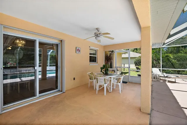 a view of a backyard with a swimming pool
