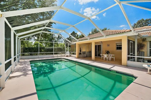 a view of a house with backyard and porch