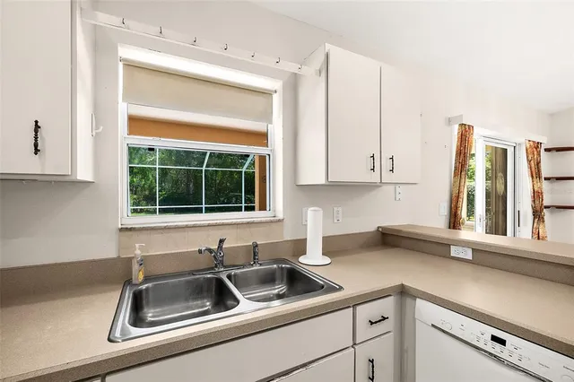 a kitchen with a sink and a window