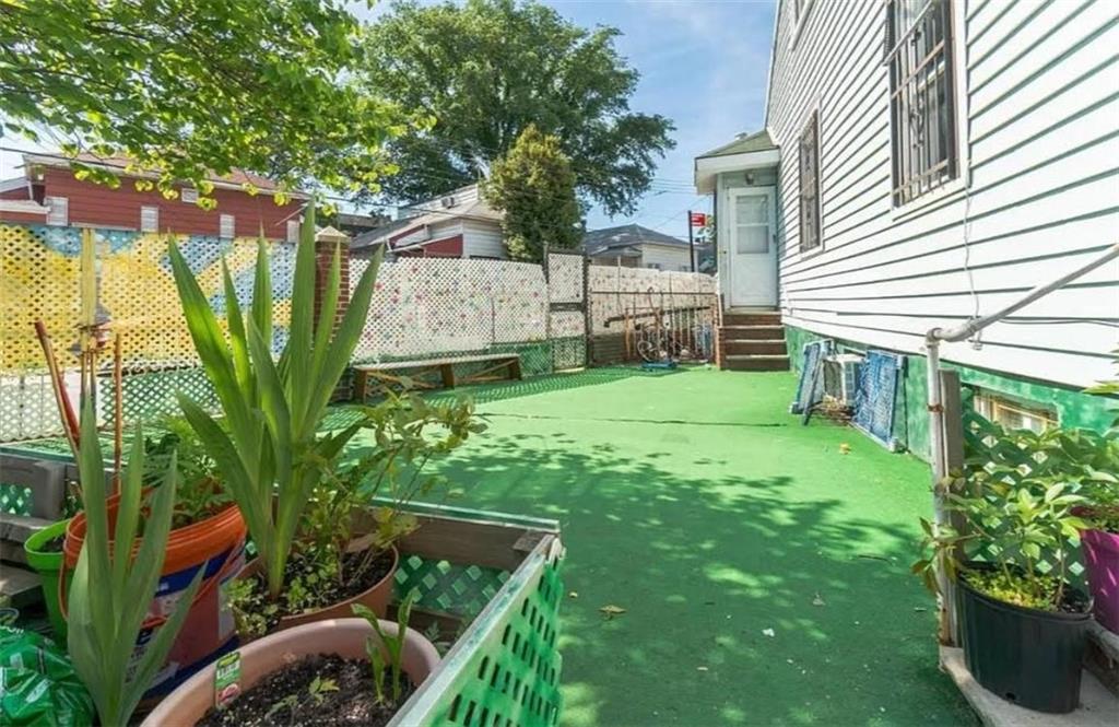 16 Brighton 10th Lane Brooklyn, NY 11235 - Photo 3 of 3 a view of backyard of house with green space