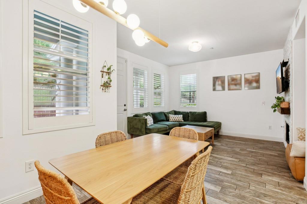 94 Hinterland Way Ladera Ranch, CA 92694 - Photo 7 of 52 a view of a dining room with furniture and wooden floor