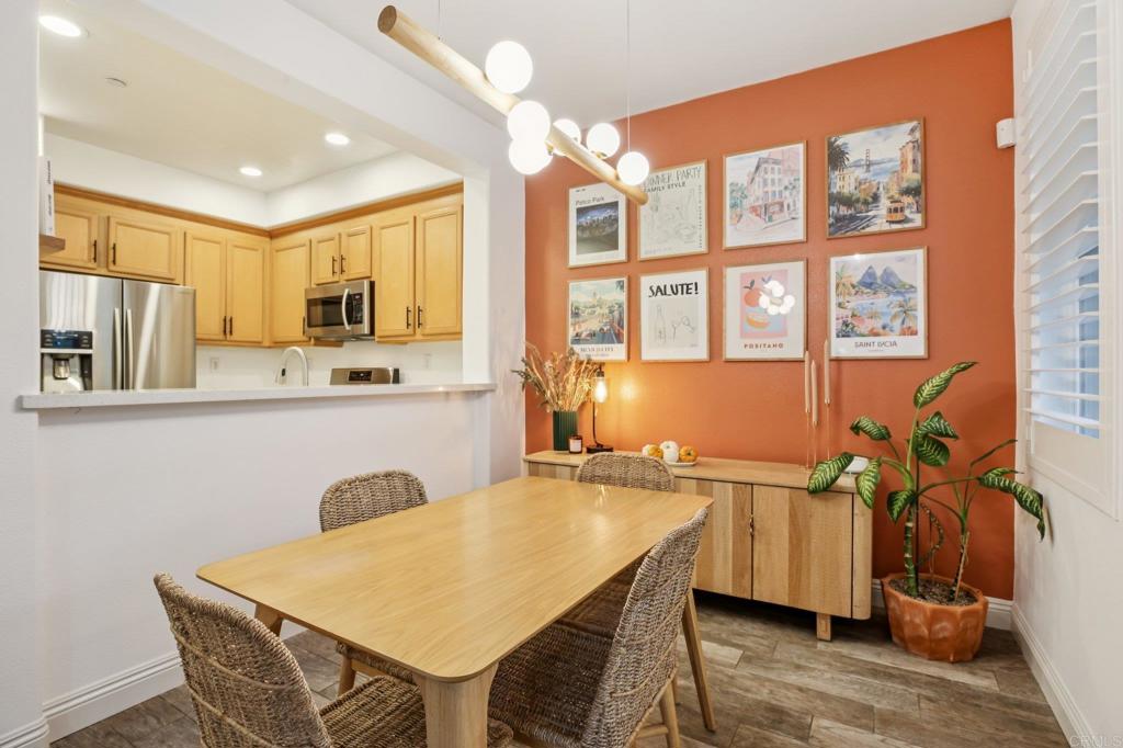 94 Hinterland Way Ladera Ranch, CA 92694 - Photo 9 of 52 a kitchen with a table chairs sink and cabinets