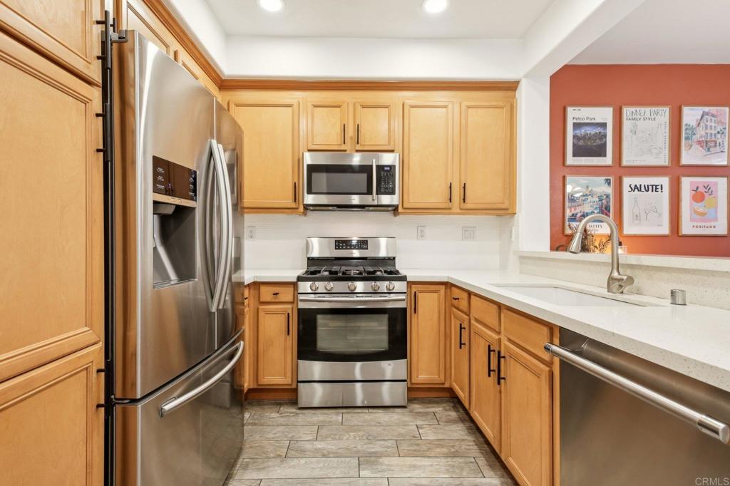 94 Hinterland Way Ladera Ranch, CA 92694 - Photo 10 of 52 a kitchen with stainless steel appliances granite countertop a refrigerator and a sink