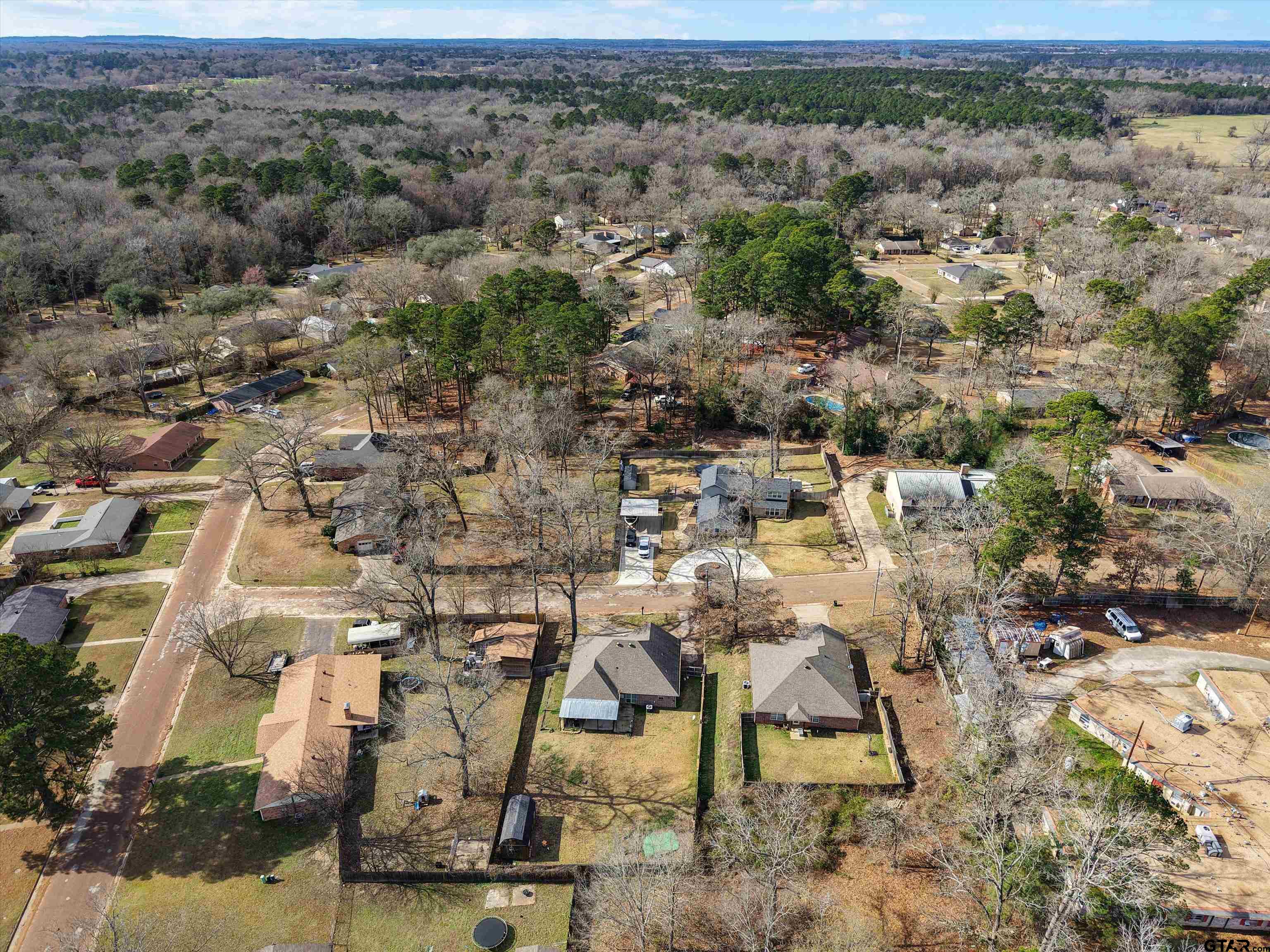 1703 Azalea Street Gilmer, TX 75644 - Photo 11 of 34 an aerial view of residential house with outdoor space