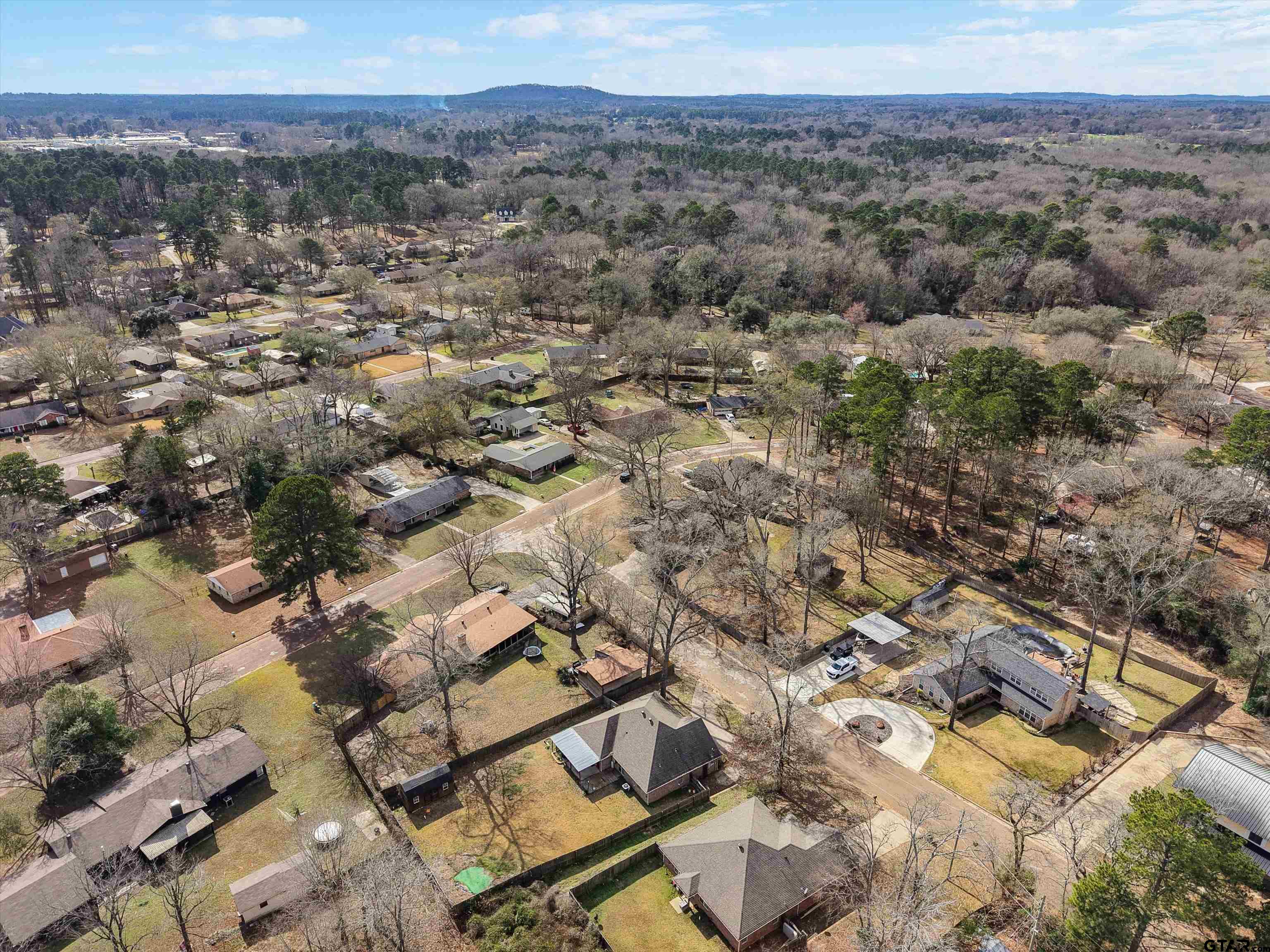 1703 Azalea Street Gilmer, TX 75644 - Photo 12 of 34 an aerial view of residential houses with outdoor space and trees