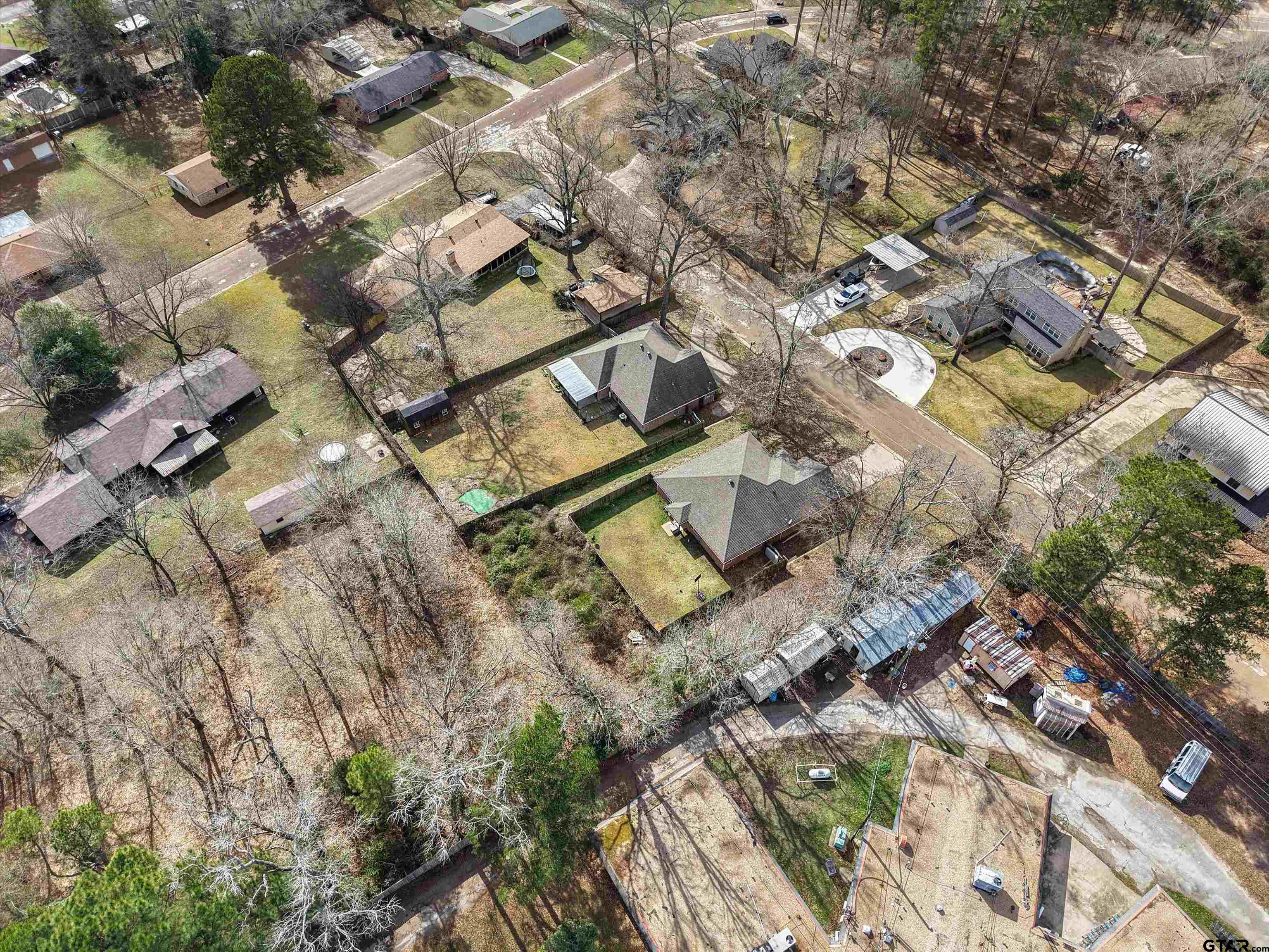 1703 Azalea Street Gilmer, TX 75644 - Photo 13 of 34 an aerial view of residential house with parking space