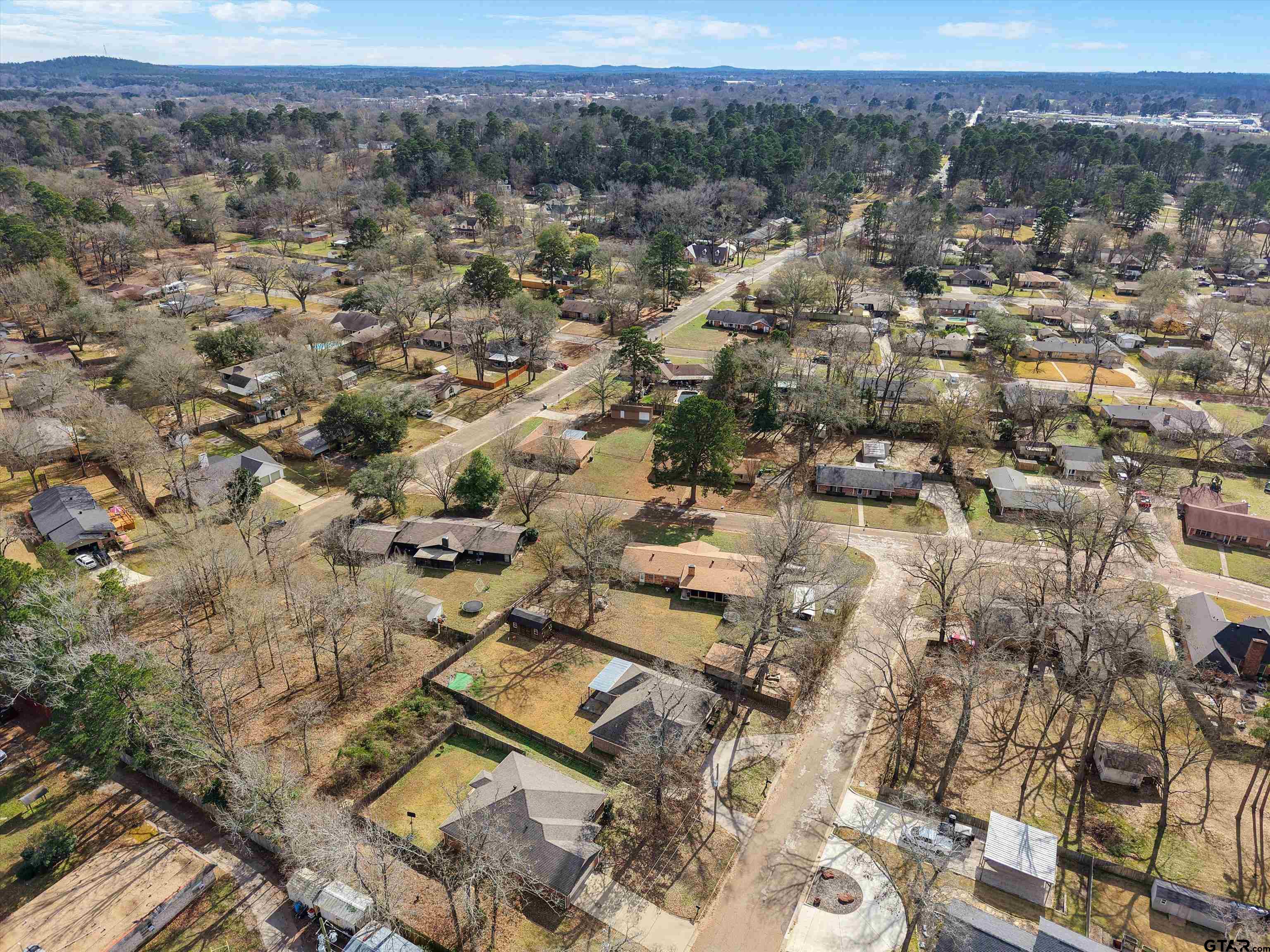 1703 Azalea Street Gilmer, TX 75644 - Photo 14 of 34 an aerial view of residential house with parking and mountain view