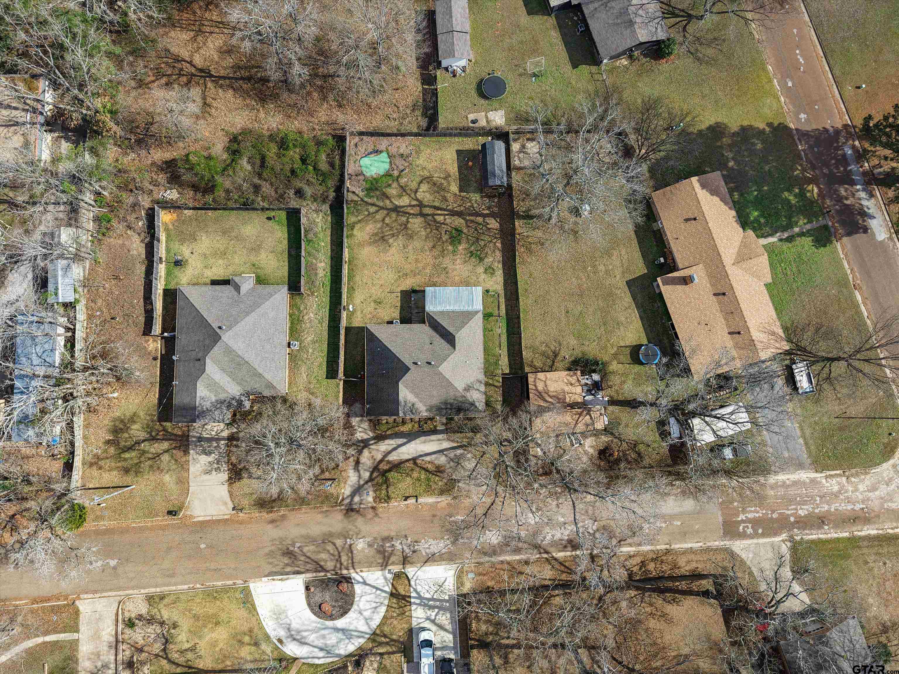 1703 Azalea Street Gilmer, TX 75644 - Photo 15 of 34 an aerial view of a house with outdoor space