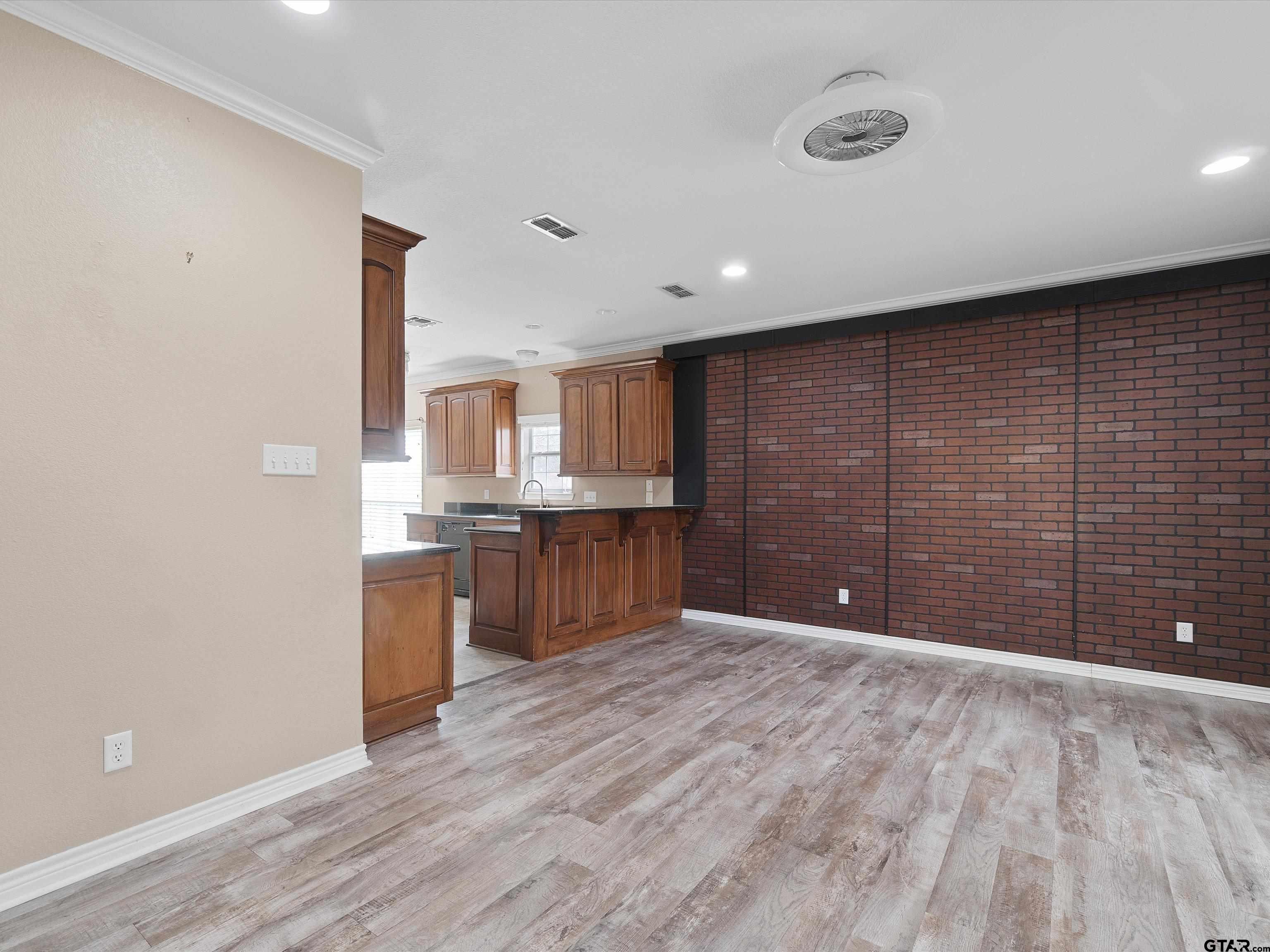 1703 Azalea Street Gilmer, TX 75644 - Photo 20 of 34 a view of a kitchen with a sink and cabinets