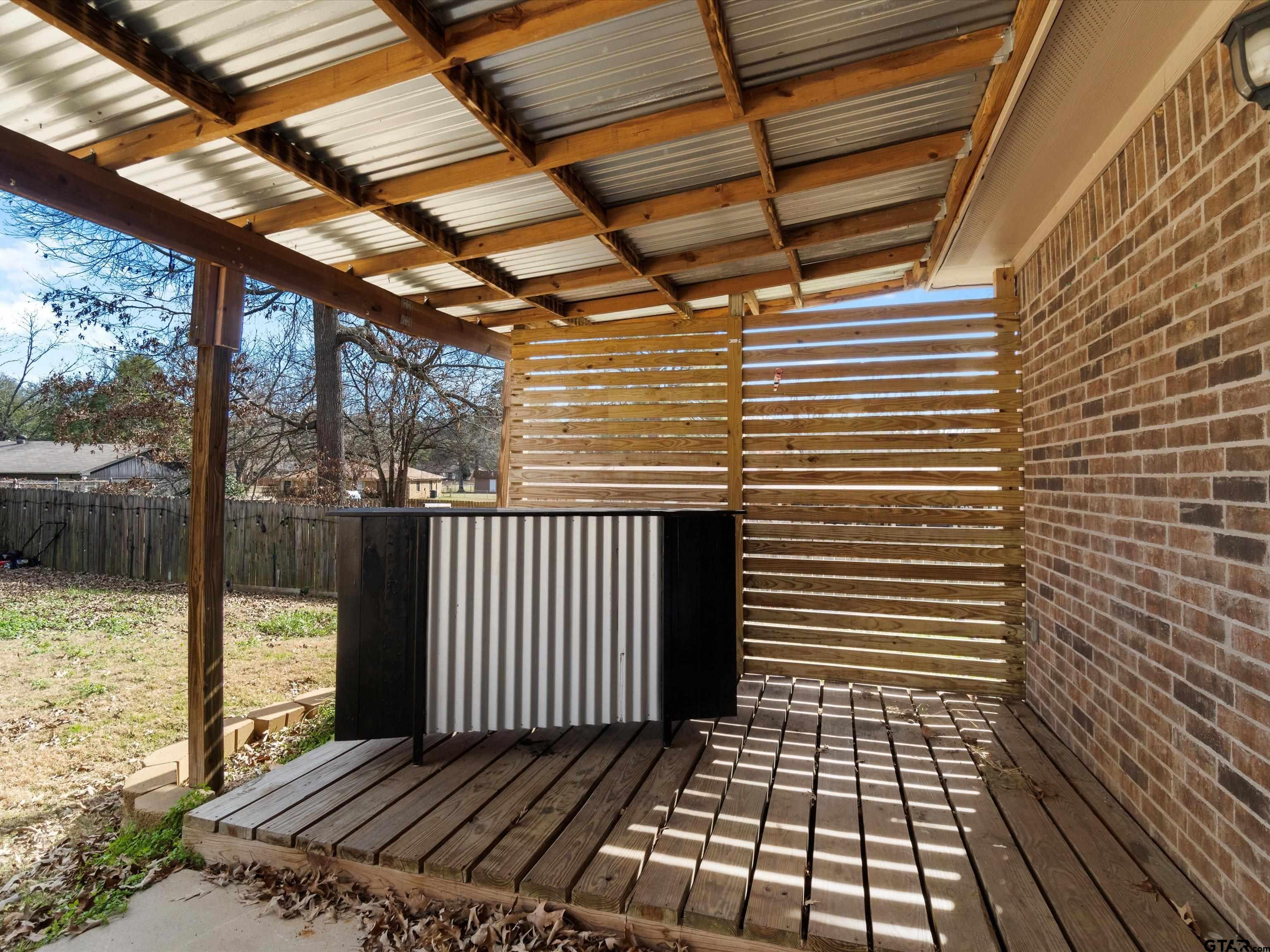 1703 Azalea Street Gilmer, TX 75644 - Photo 5 of 34 a view of a balcony with wooden floor