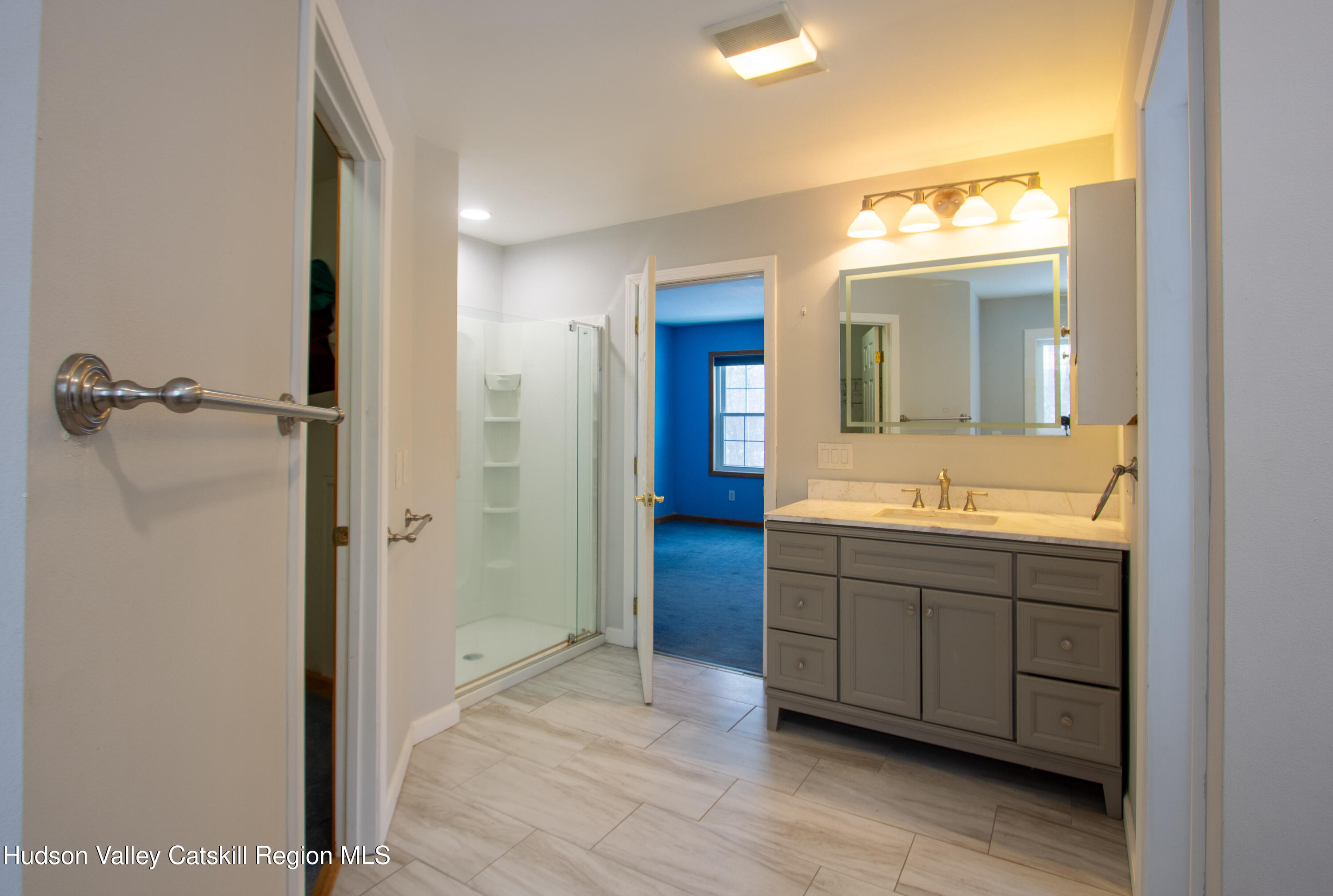 521 White Mills Road Valatie, NY 12184 - Photo 11 of 17 a bathroom with a sink and a mirror