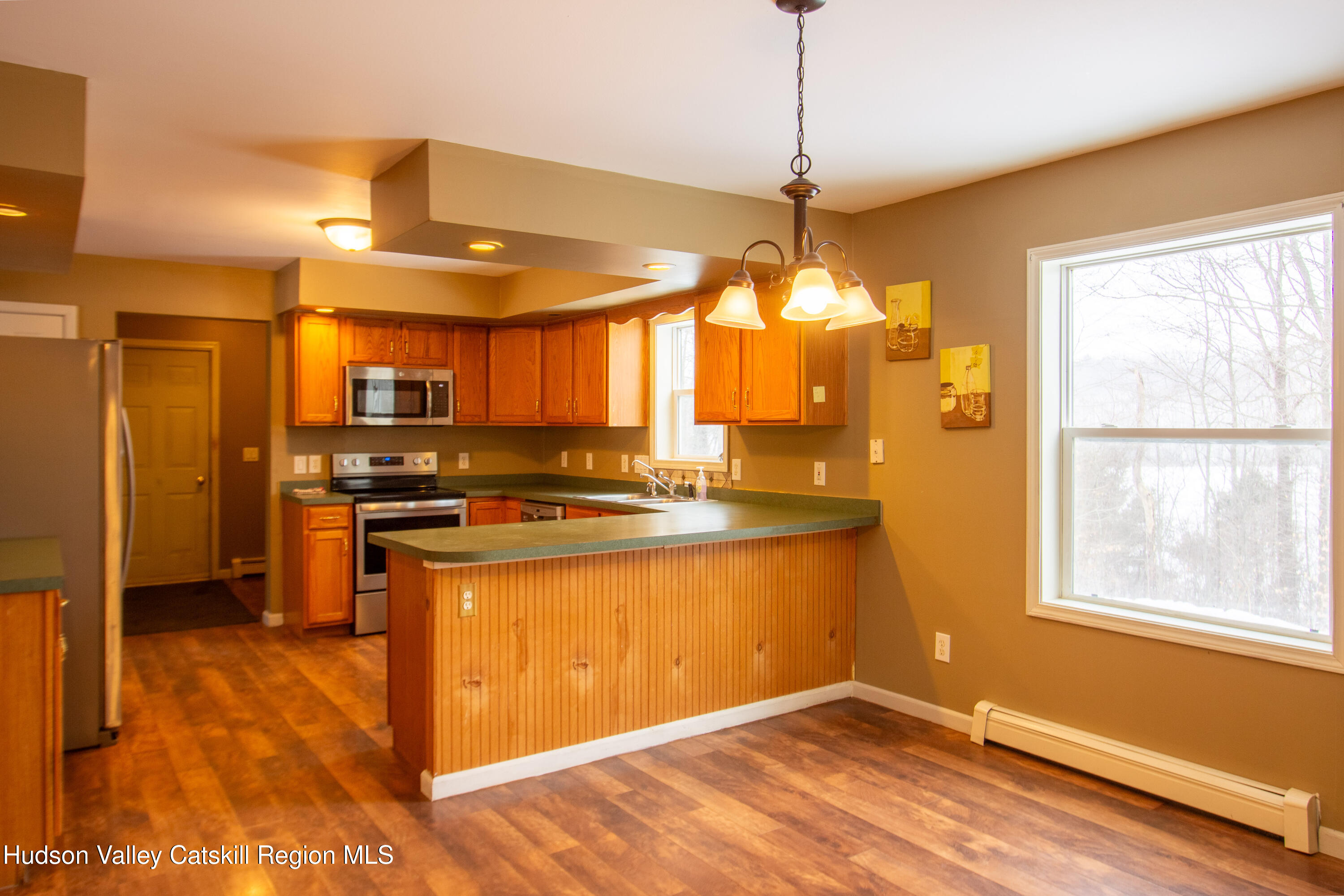521 White Mills Road Valatie, NY 12184 - Photo 5 of 17 a kitchen with stainless steel appliances granite countertop a sink a stove and a refrigerator