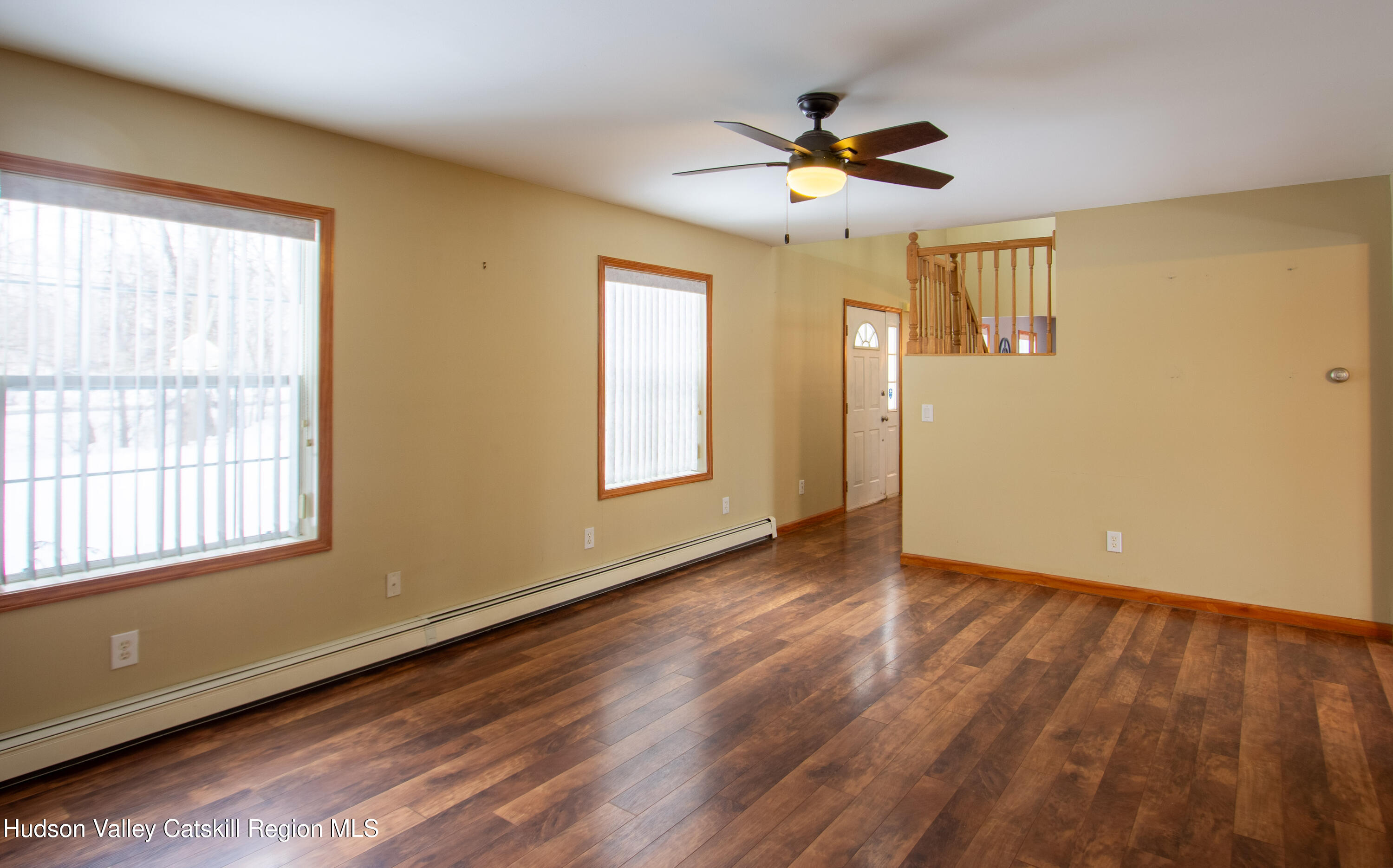 521 White Mills Road Valatie, NY 12184 - Photo 7 of 17 a view of empty room with wooden floor and fan