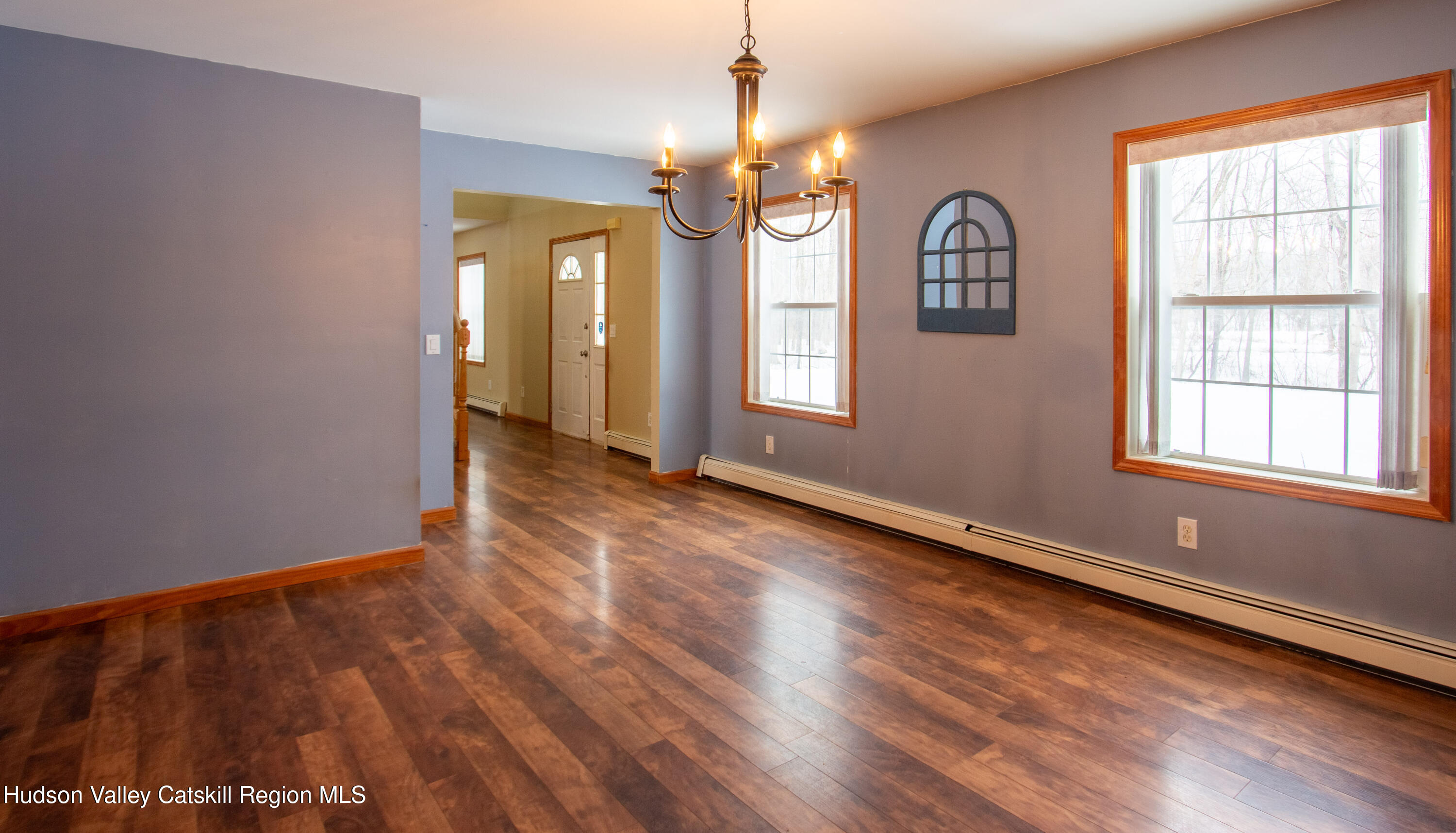 521 White Mills Road Valatie, NY 12184 - Photo 8 of 17 an empty room with wooden floor and windows