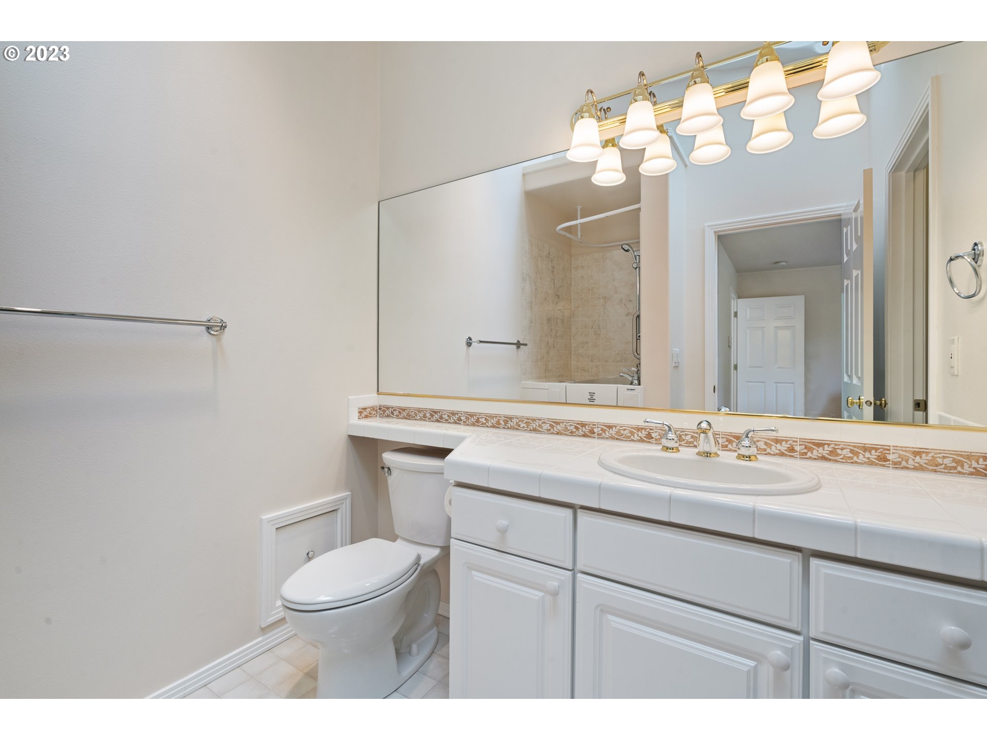 3490 Chaparrel Loop West Linn, OR 97068 - Photo 13 of 35 a bathroom with a granite countertop sink mirror vanity and toilet