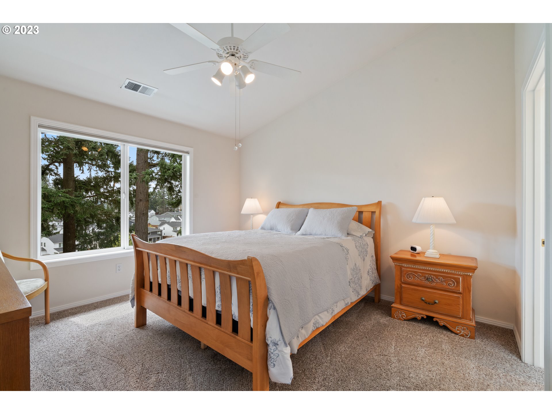 3490 Chaparrel Loop West Linn, OR 97068 - Photo 15 of 35 a bed room with a bed and a window