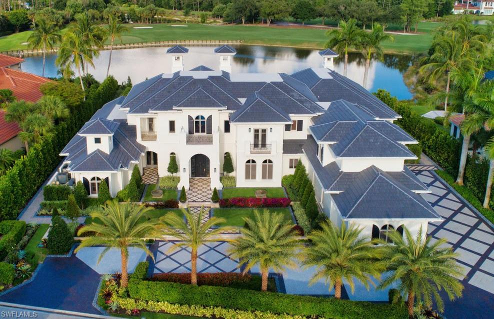 an aerial view of a house with a garden and plants