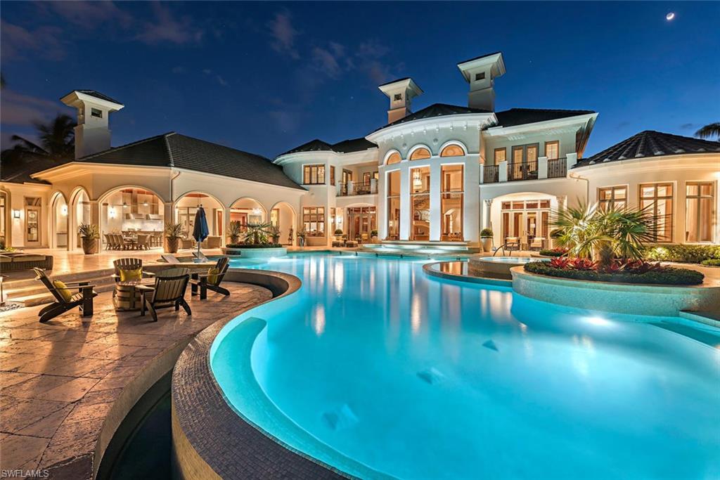 1420 Nighthawk Pointe Naples, FL 34105 - Photo 14 of 14 an aerial view of a swimming pool with a table and chairs