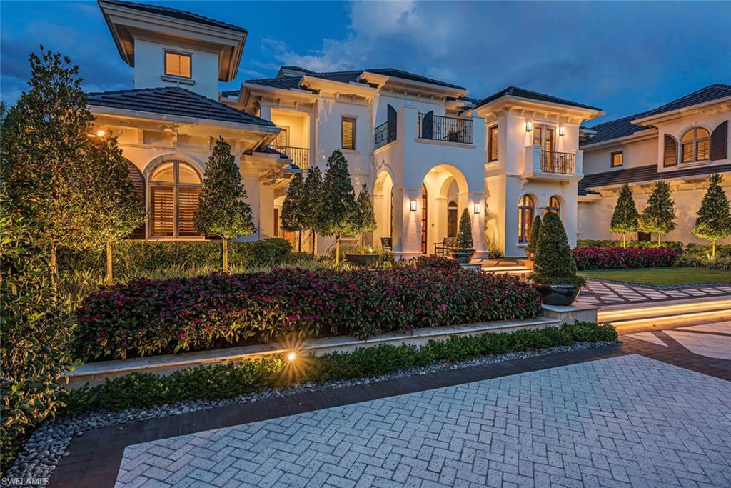 1420 Nighthawk Pointe Naples, FL 34105 - Photo 4 of 14 a front view of house with a yard