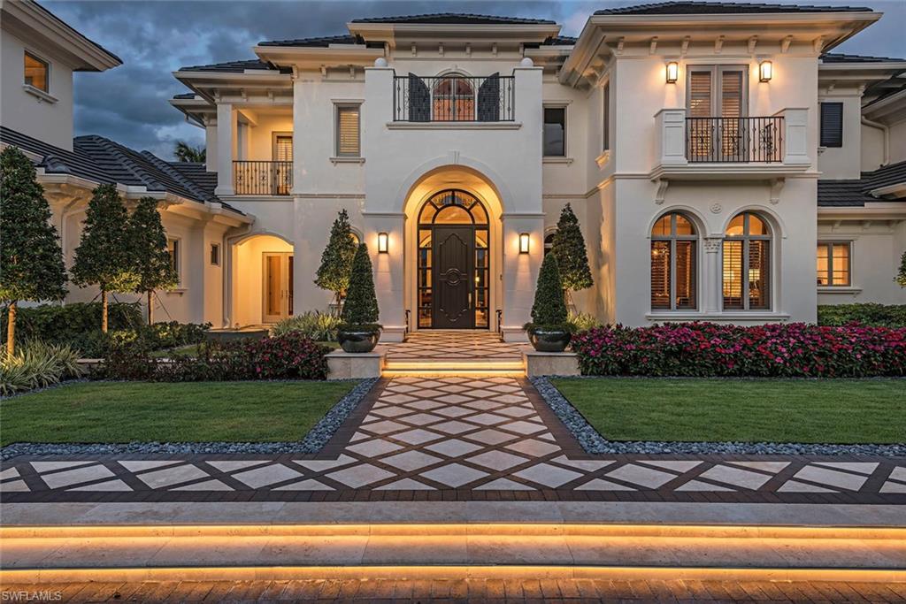 1420 Nighthawk Pointe Naples, FL 34105 - Photo 5 of 14 a front view of a house with garden