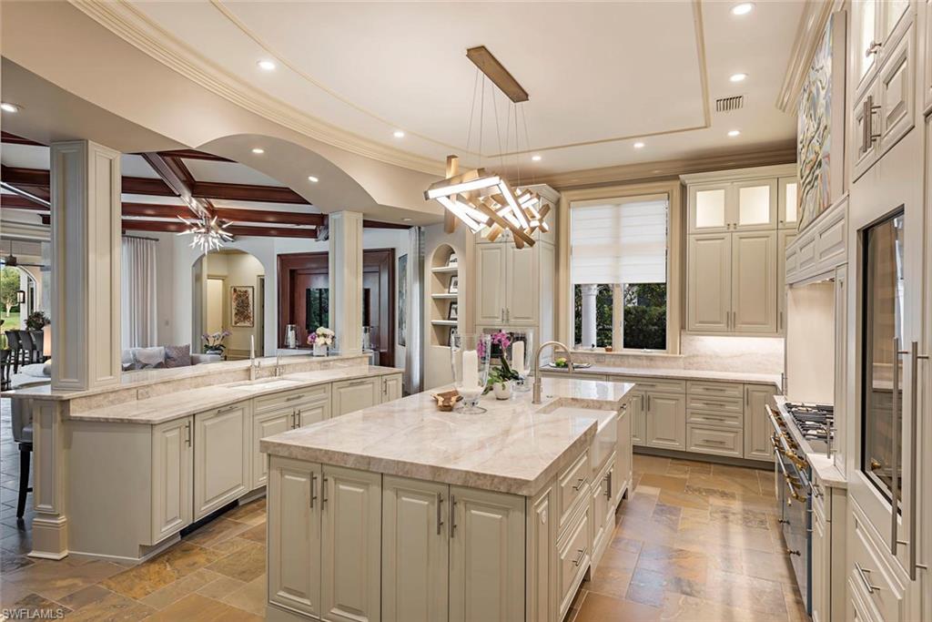 1420 Nighthawk Pointe Naples, FL 34105 - Photo 6 of 14 a kitchen with a sink and refrigerator
