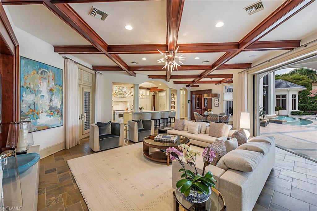 1420 Nighthawk Pointe Naples, FL 34105 - Photo 8 of 14 a living room with furniture potted plant and a large window