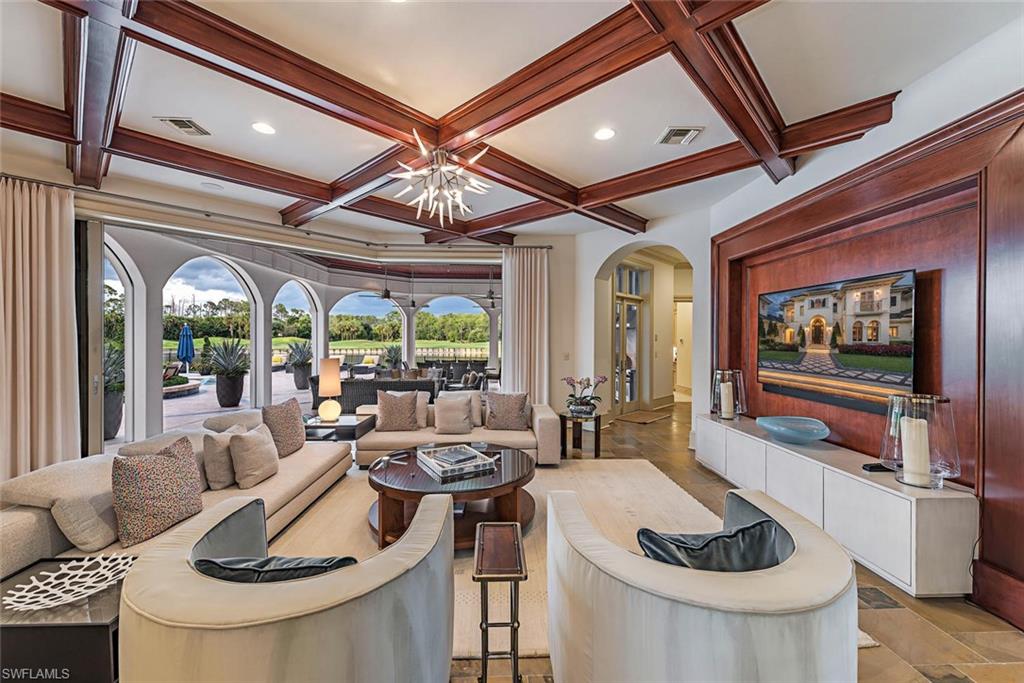 1420 Nighthawk Pointe Naples, FL 34105 - Photo 9 of 14 a living room with furniture and a large window