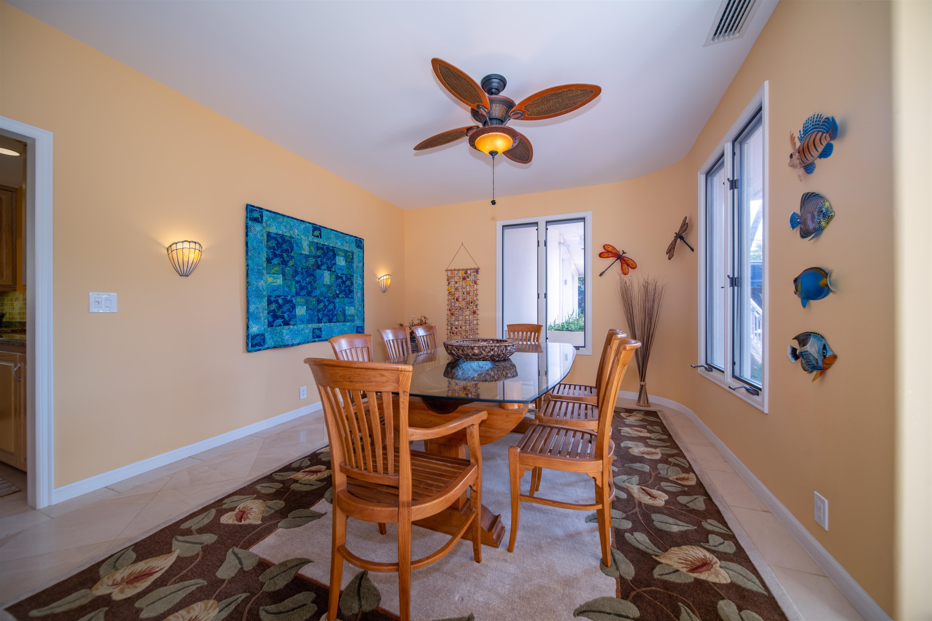 135 Kaimanu Place Kihei, HI 96753 - Photo 14 of 29 a dining room with furniture a rug and a window