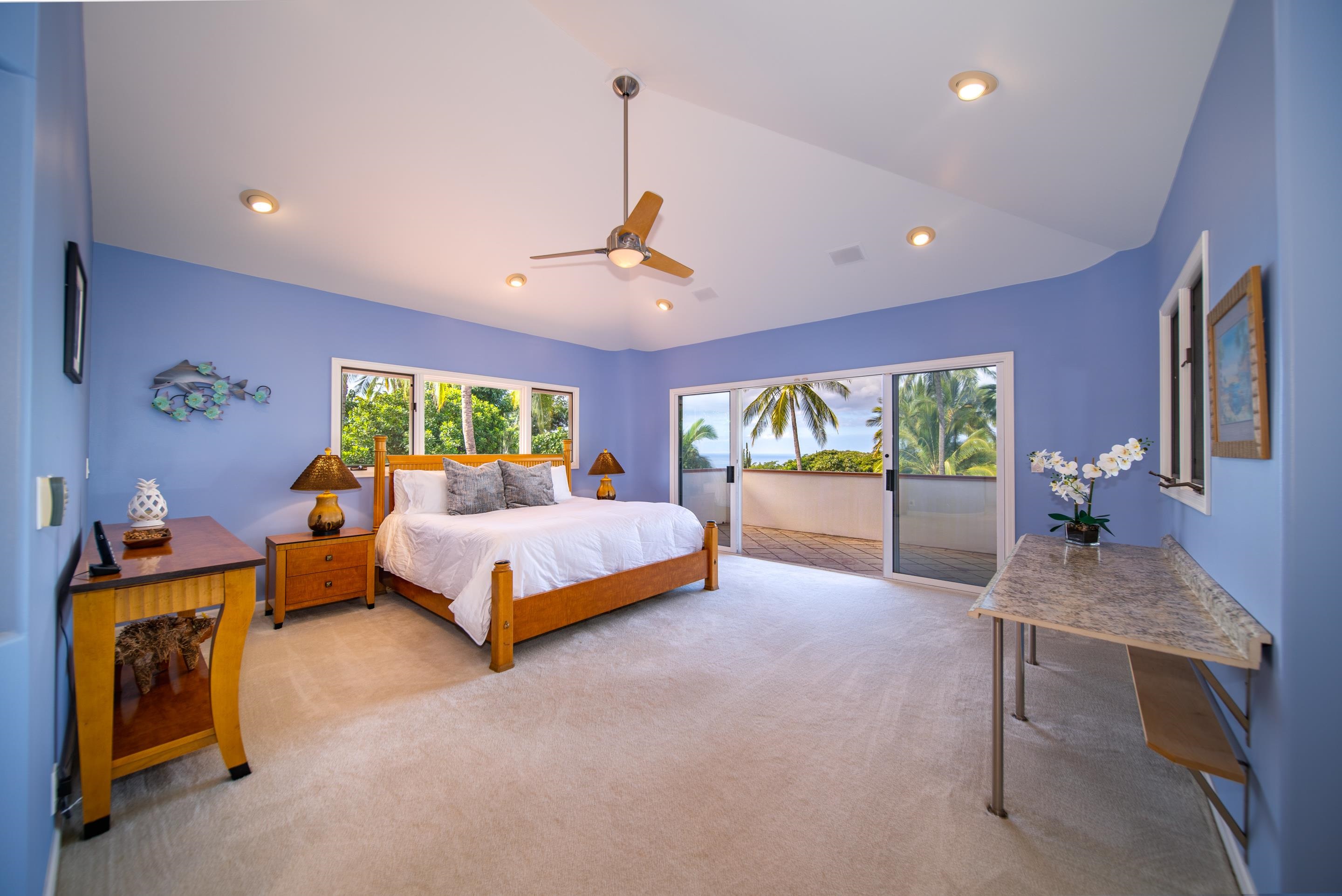135 Kaimanu Place Kihei, HI 96753 - Photo 16 of 29 a bed room with a bed and a chandelier