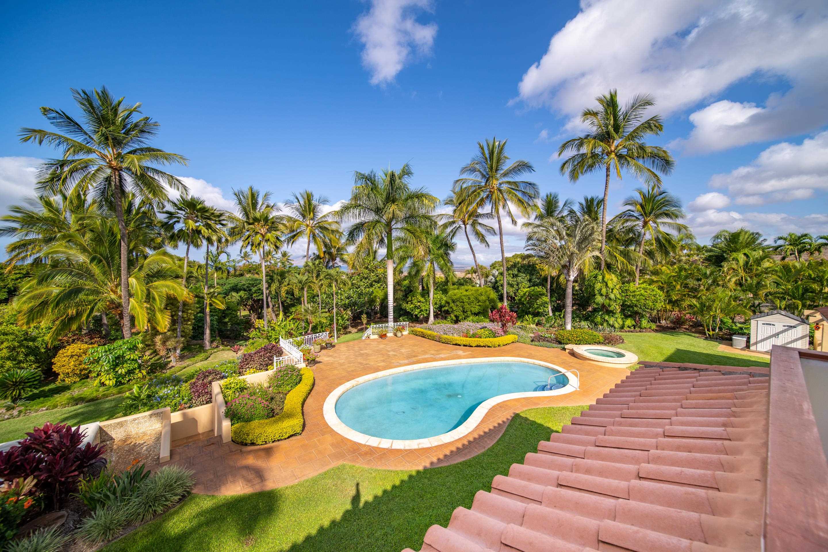 135 Kaimanu Place Kihei, HI 96753 - Photo 17 of 29 a swimming pool with yard and outdoor seating
