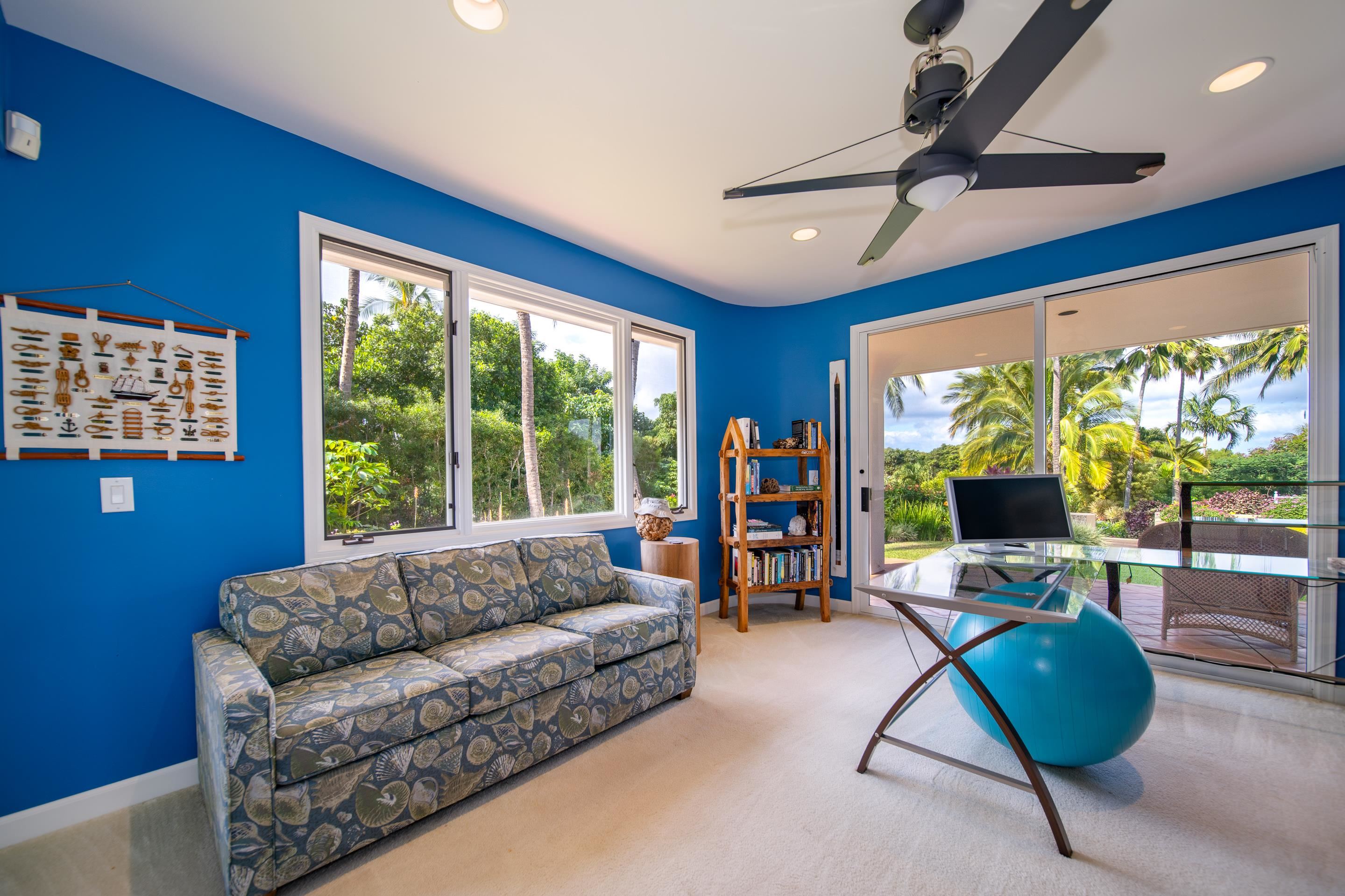135 Kaimanu Place Kihei, HI 96753 - Photo 25 of 29 a living room with furniture and a flat screen tv
