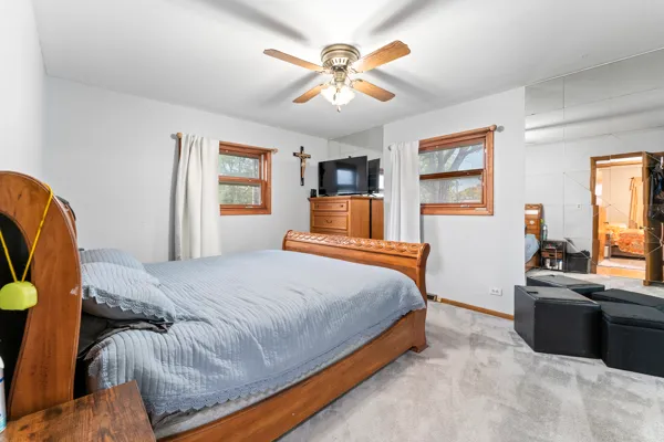 a bedroom with a bed and dresser