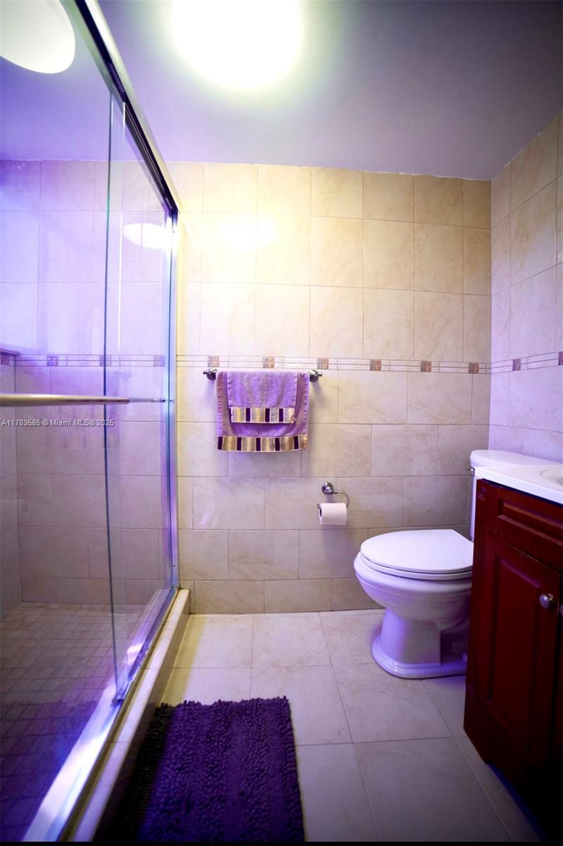 1380 West 41st Street, Unit 101 Hialeah, FL 33012 - Photo 18 of 23 a bathroom with a sink a toilet and shower