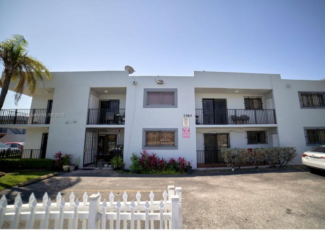 1380 West 41st Street, Unit 101 Hialeah, FL 33012 - Photo 2 of 23 a front view of house with yard