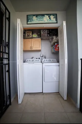 a utility room with washer and dryer