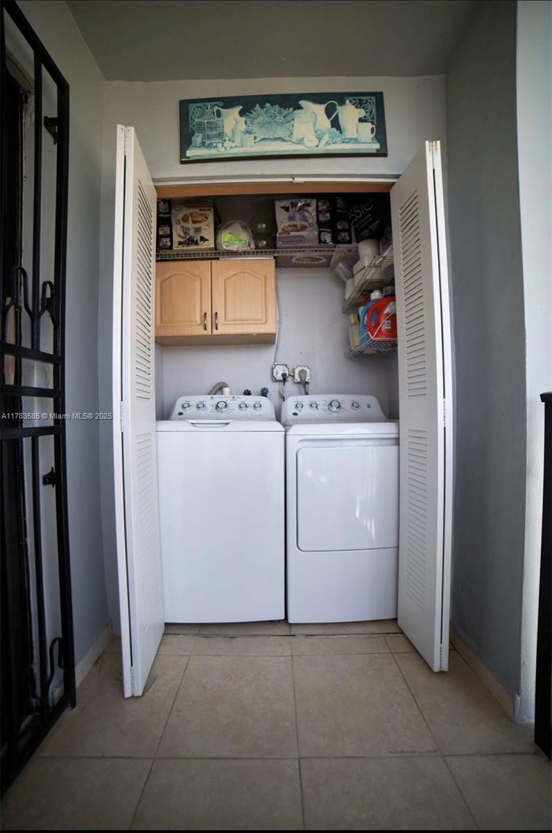 1380 West 41st Street, Unit 101 Hialeah, FL 33012 - Photo 22 of 23 a utility room with washer and dryer