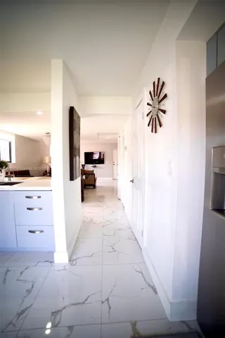 a view of living room with furniture and a flat screen tv