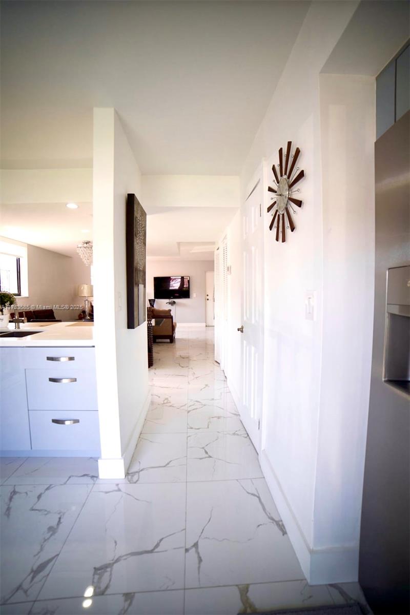 1380 West 41st Street, Unit 101 Hialeah, FL 33012 - Photo 9 of 23 a view of living room with furniture and a flat screen tv