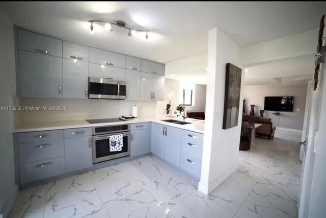 a large kitchen with cabinets