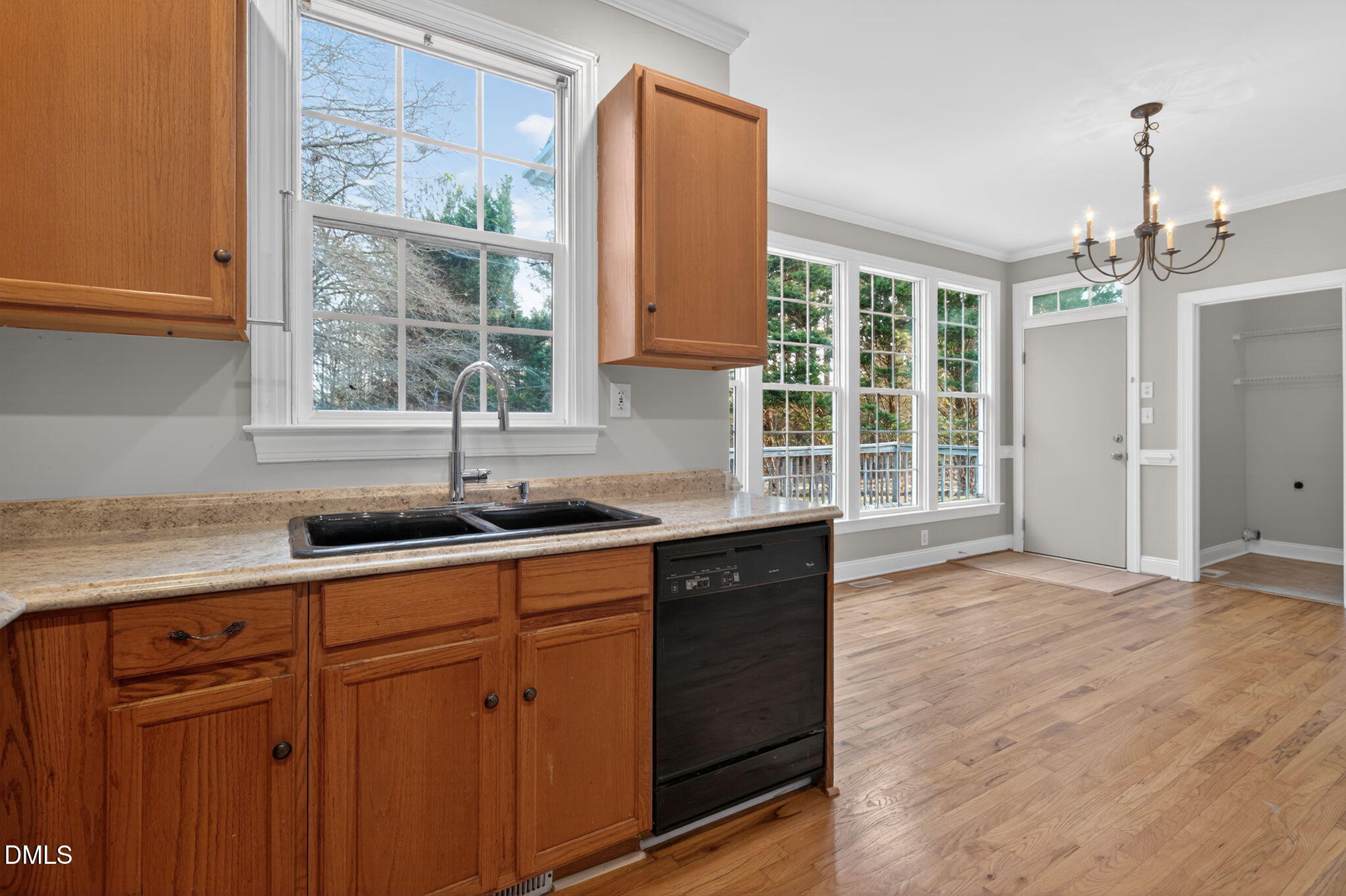 10000 Kennebec Road Willow Spring, NC 27592 - Photo 10 of 38 a kitchen with granite countertop a sink stainless steel appliances and cabinets