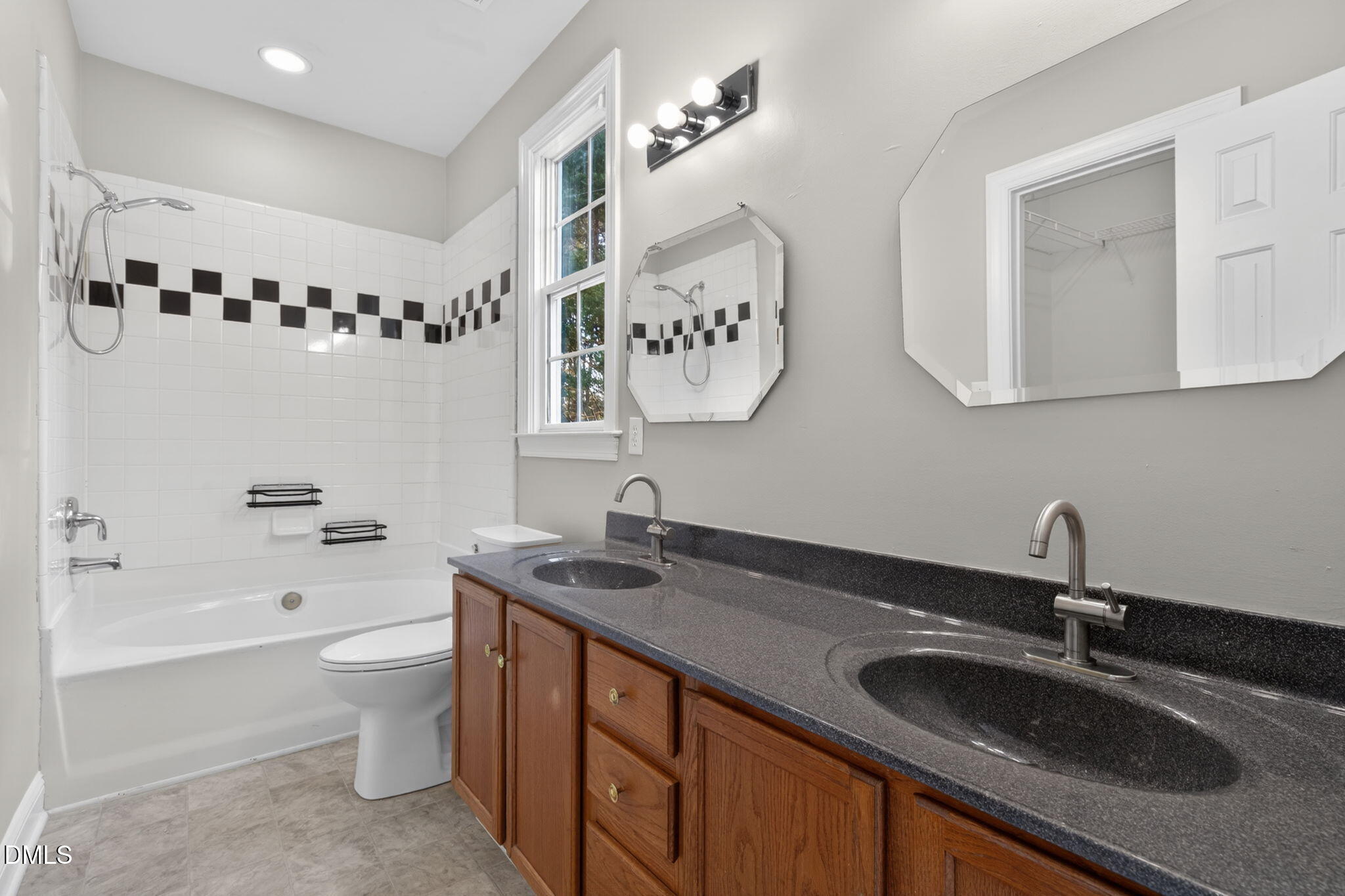 10000 Kennebec Road Willow Spring, NC 27592 - Photo 19 of 38 a bathroom with a sink a toilet and a bathtub
