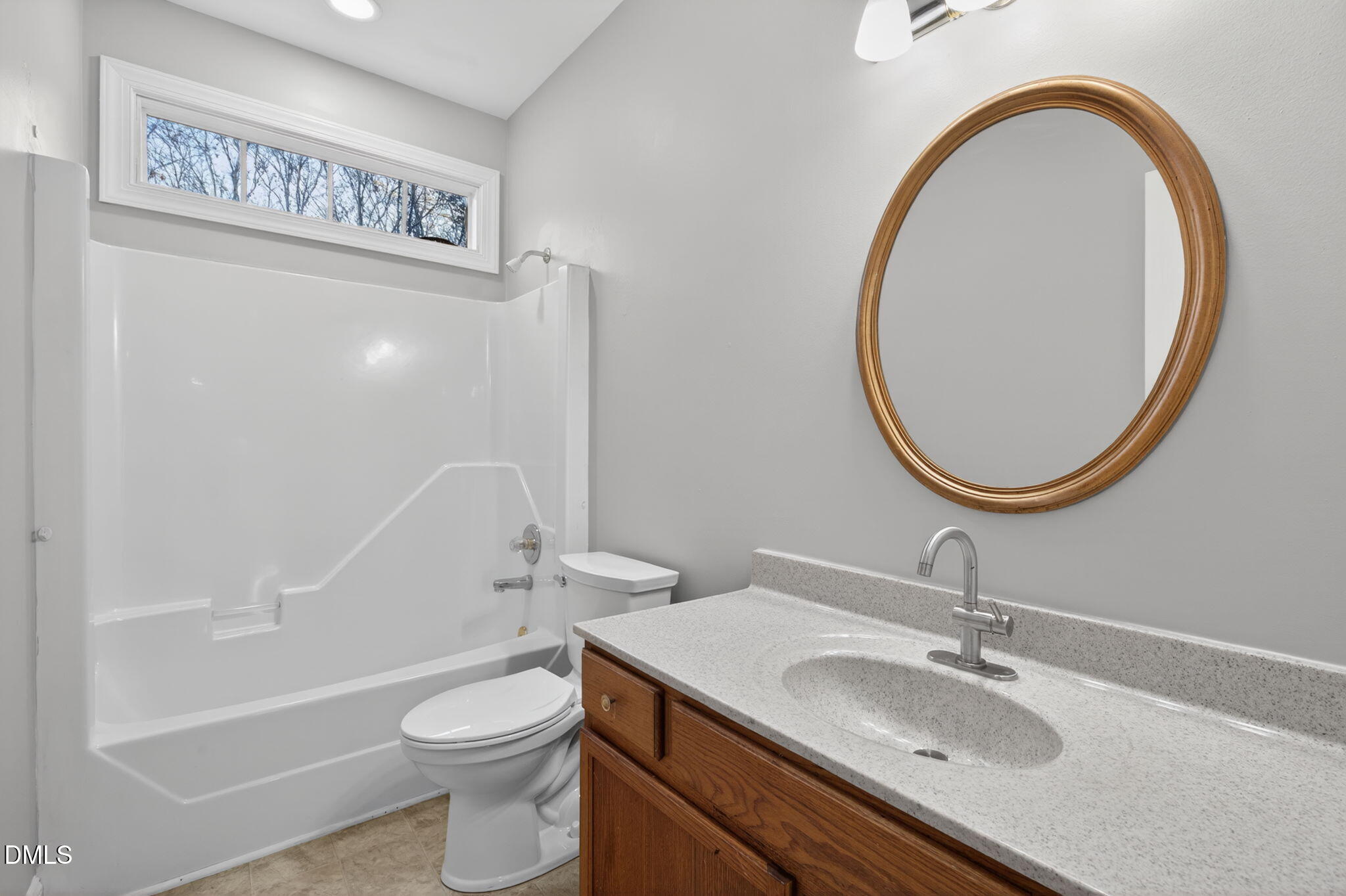 10000 Kennebec Road Willow Spring, NC 27592 - Photo 24 of 38 a bathroom with a sink a toilet and a mirror