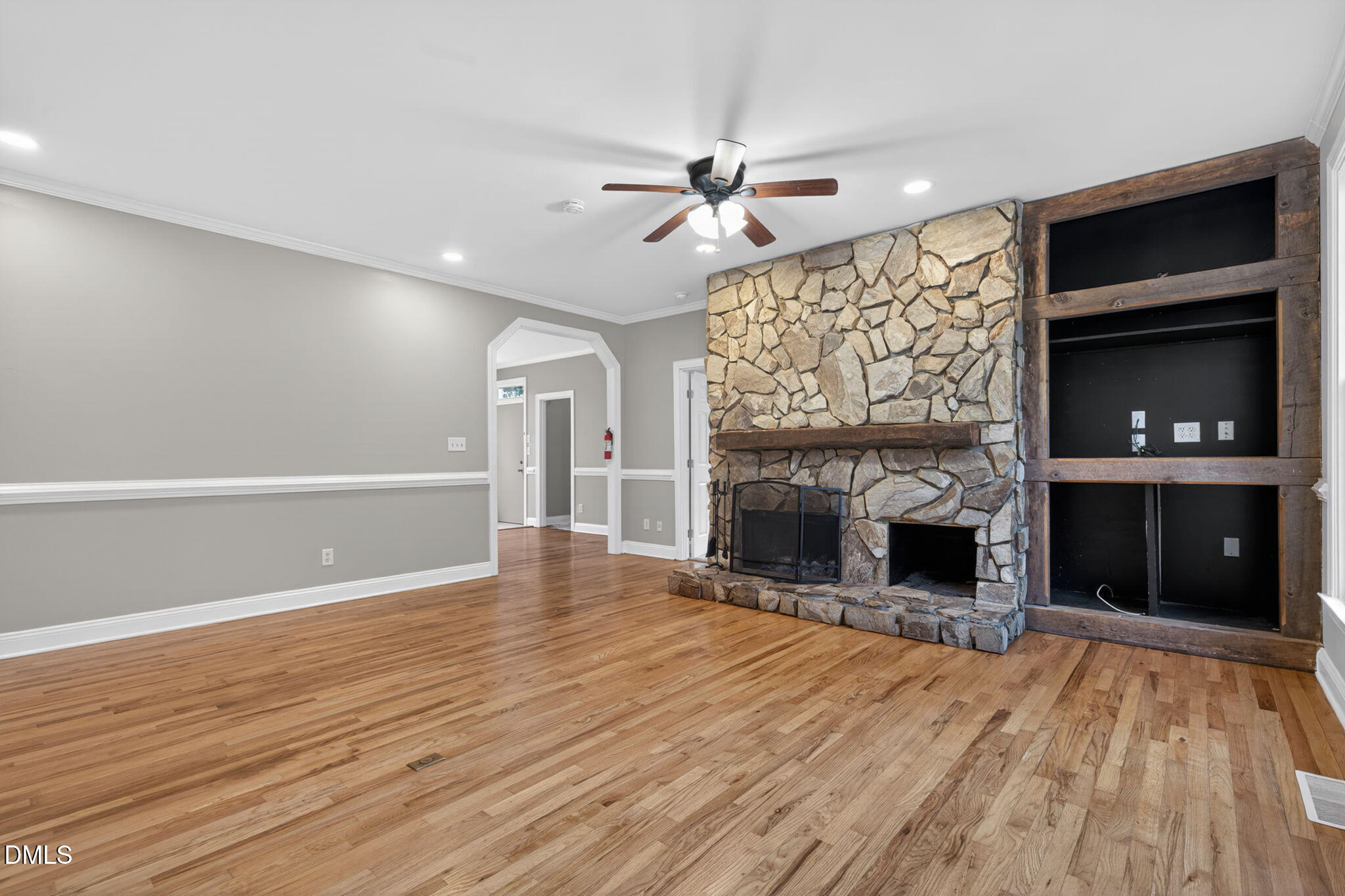 10000 Kennebec Road Willow Spring, NC 27592 - Photo 5 of 38 a view of an empty room with a fireplace and a window