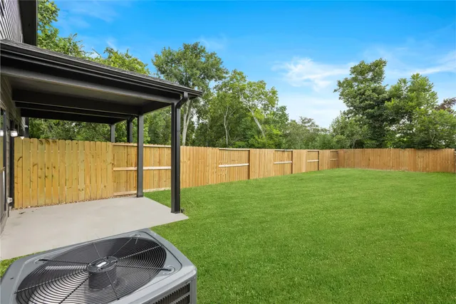 a view of backyard with small cabin