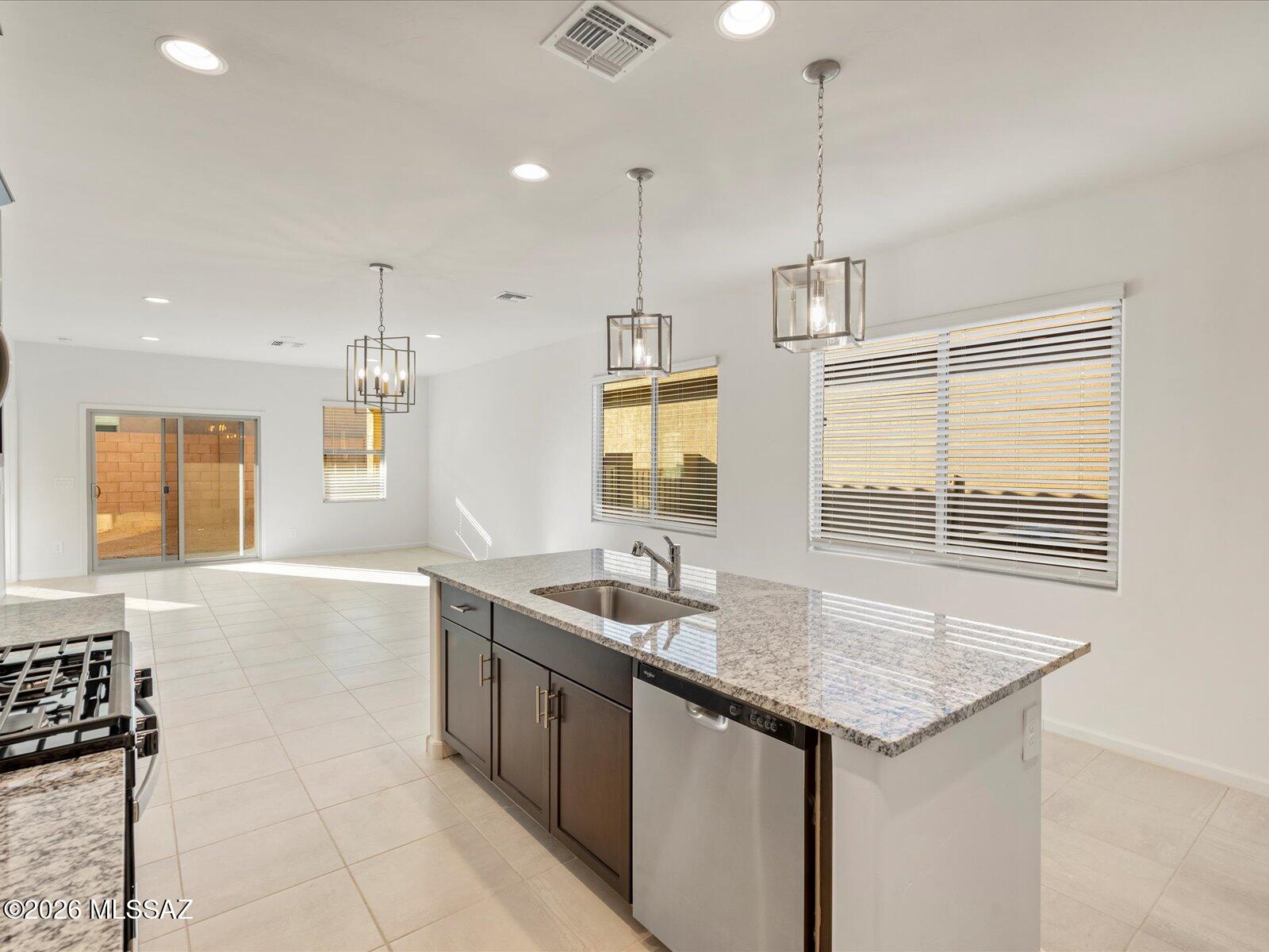 5169 West Gainer Ridge Road Tucson, AZ 85757 - Photo 5 of 17 Photos shown are of a similar floor plan and are intended to provide a close representation of the actual home. Images may include features, finishes, countertops, fixtures, flooring, cabinets, color of cabinets, furnishings, or decorator elements that are not part of the standard offering. While this specific home may include some of these features, please note it may not include all.