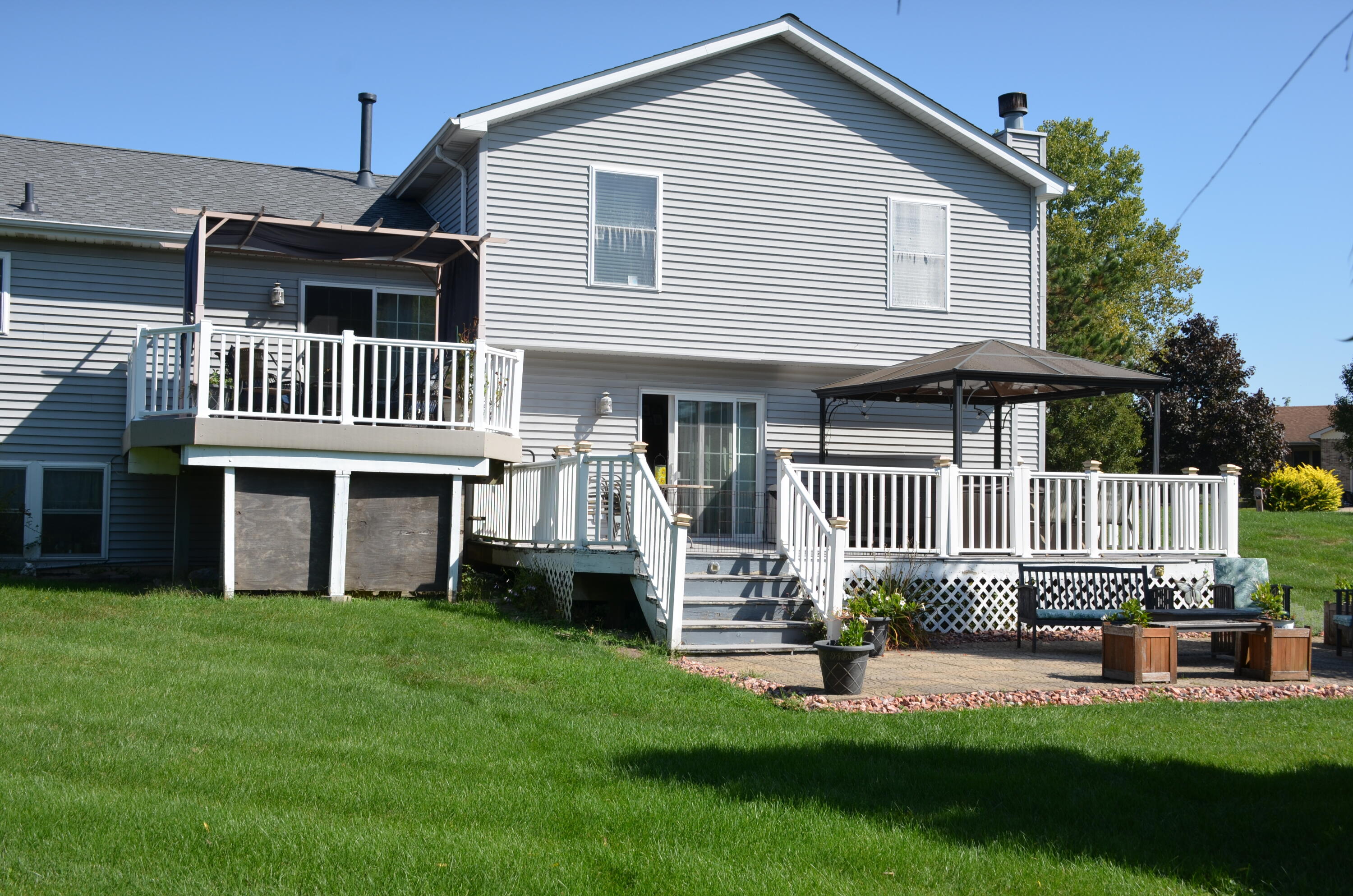 8262 Heron Lake Road St. John, IN 46373 - Photo 16 of 51 a front view of a house with a yard and porch