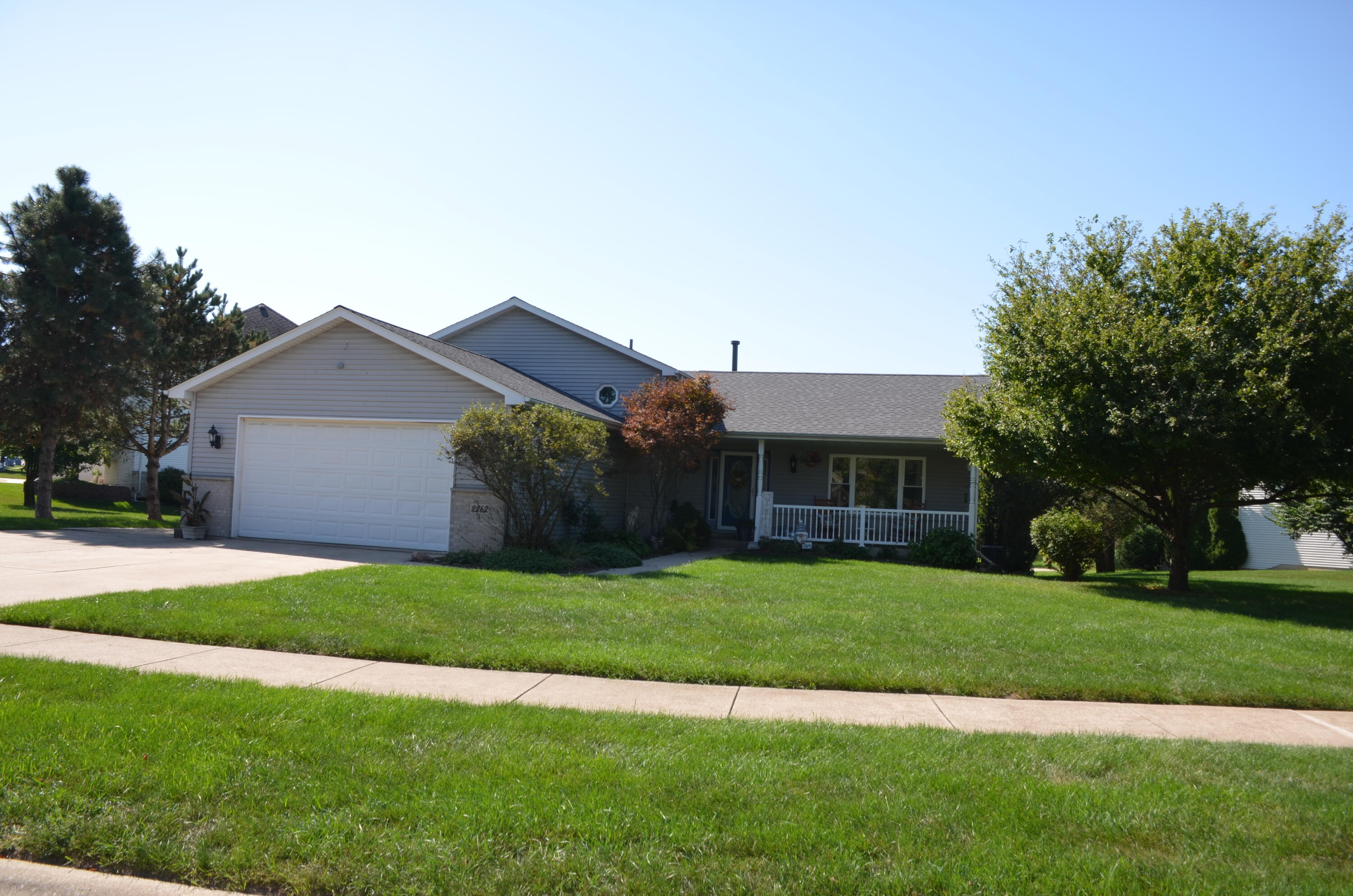 8262 Heron Lake Road St. John, IN 46373 - Photo 2 of 51 a front view of house with yard and green space