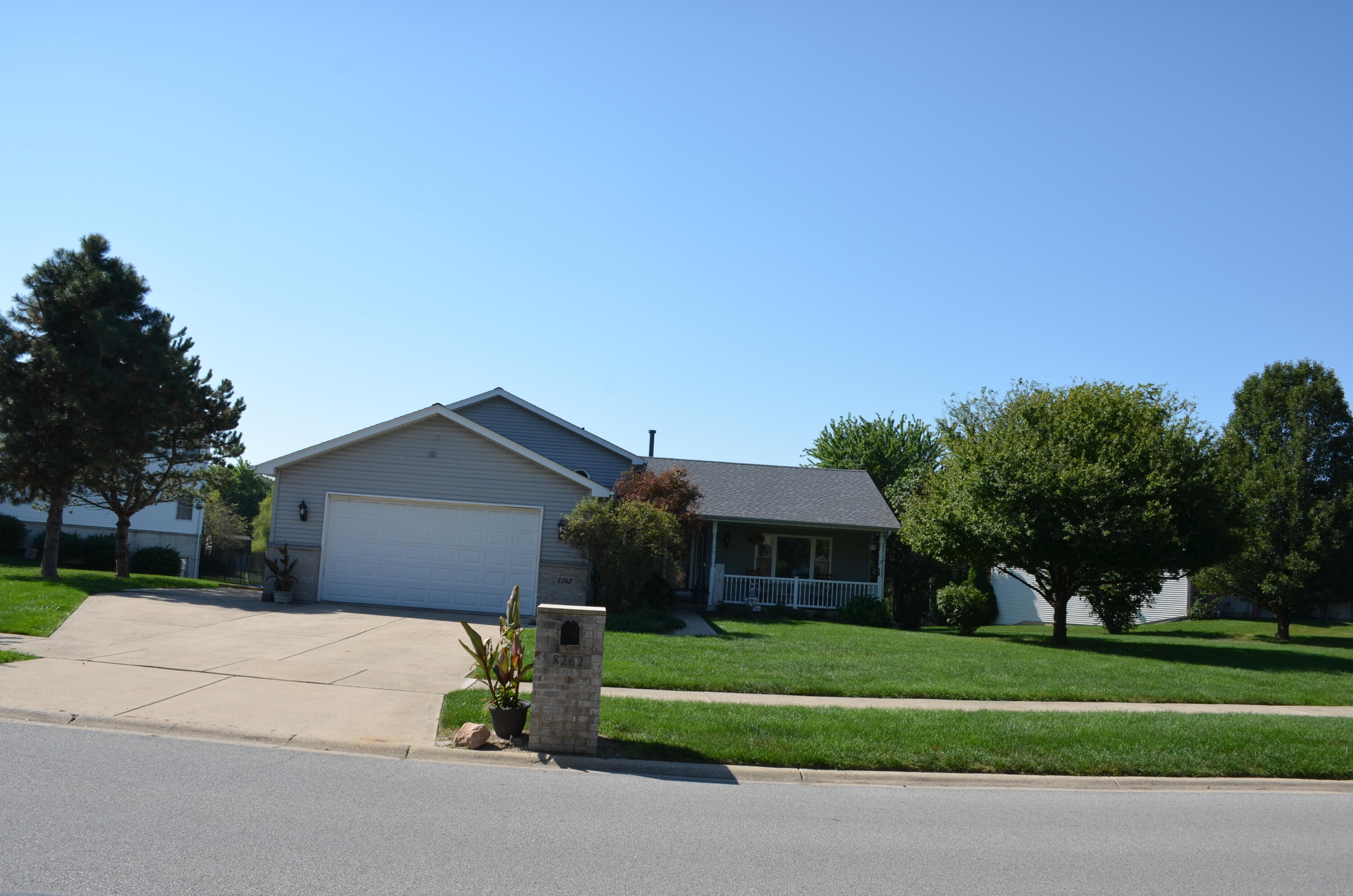 8262 Heron Lake Road St. John, IN 46373 - Photo 27 of 51 a front view of a house with a garden