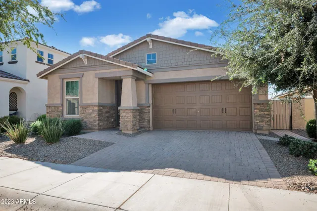 a front view of a house with garage