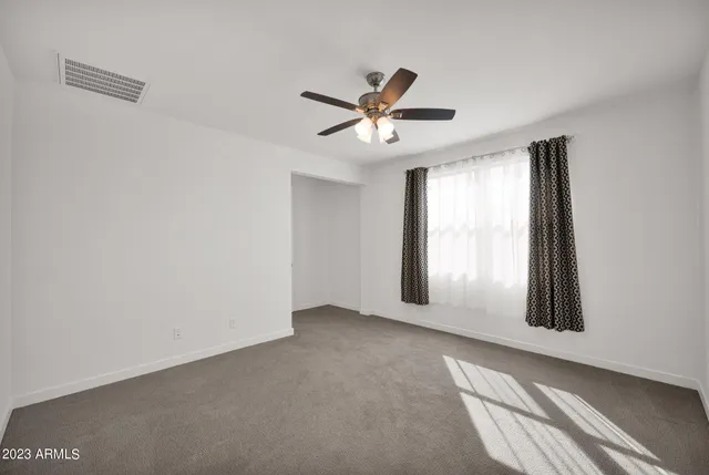 a view of an empty room and window